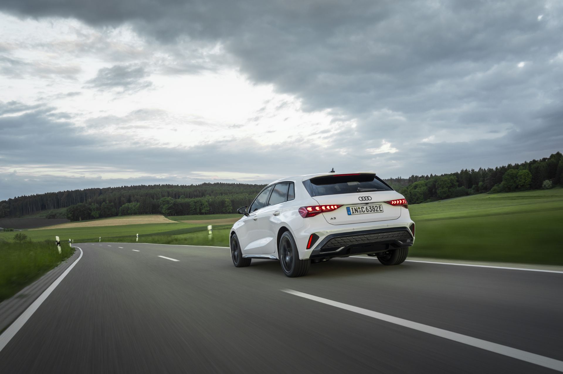 2027 audi a3 sportback e hybrid driving rear three quarter white