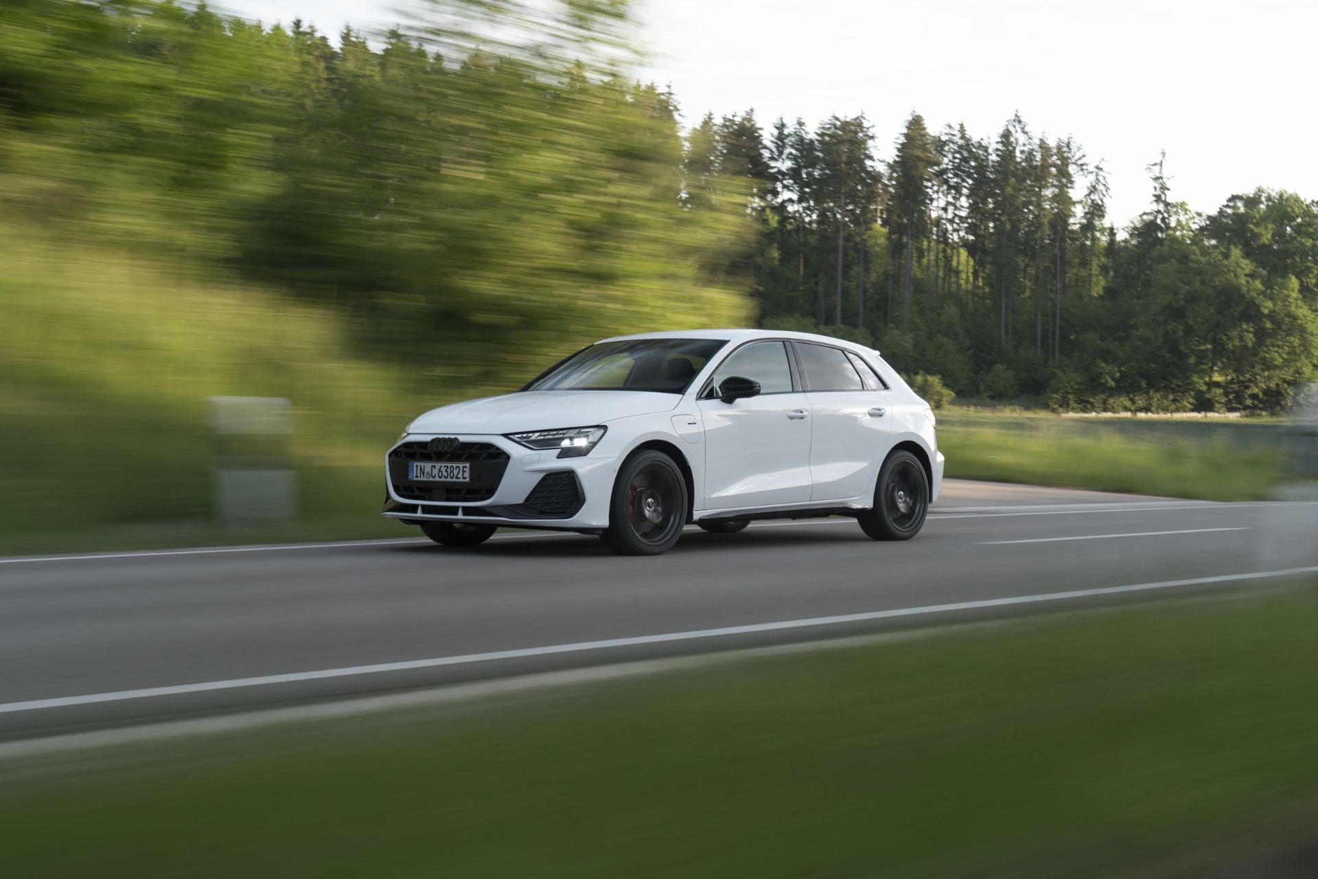 2027 audi a3 sportback e hybrid driving front three quarter white