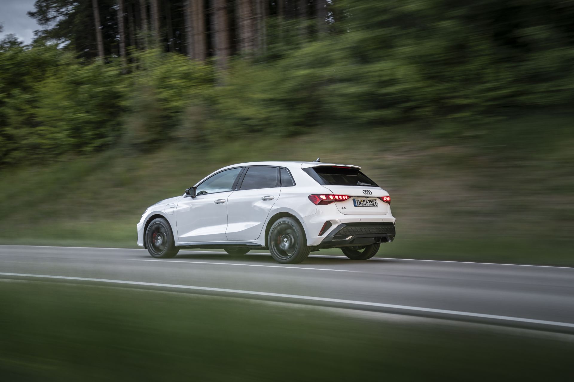 2027 audi a3 sportback e hybrid driving rear forest white