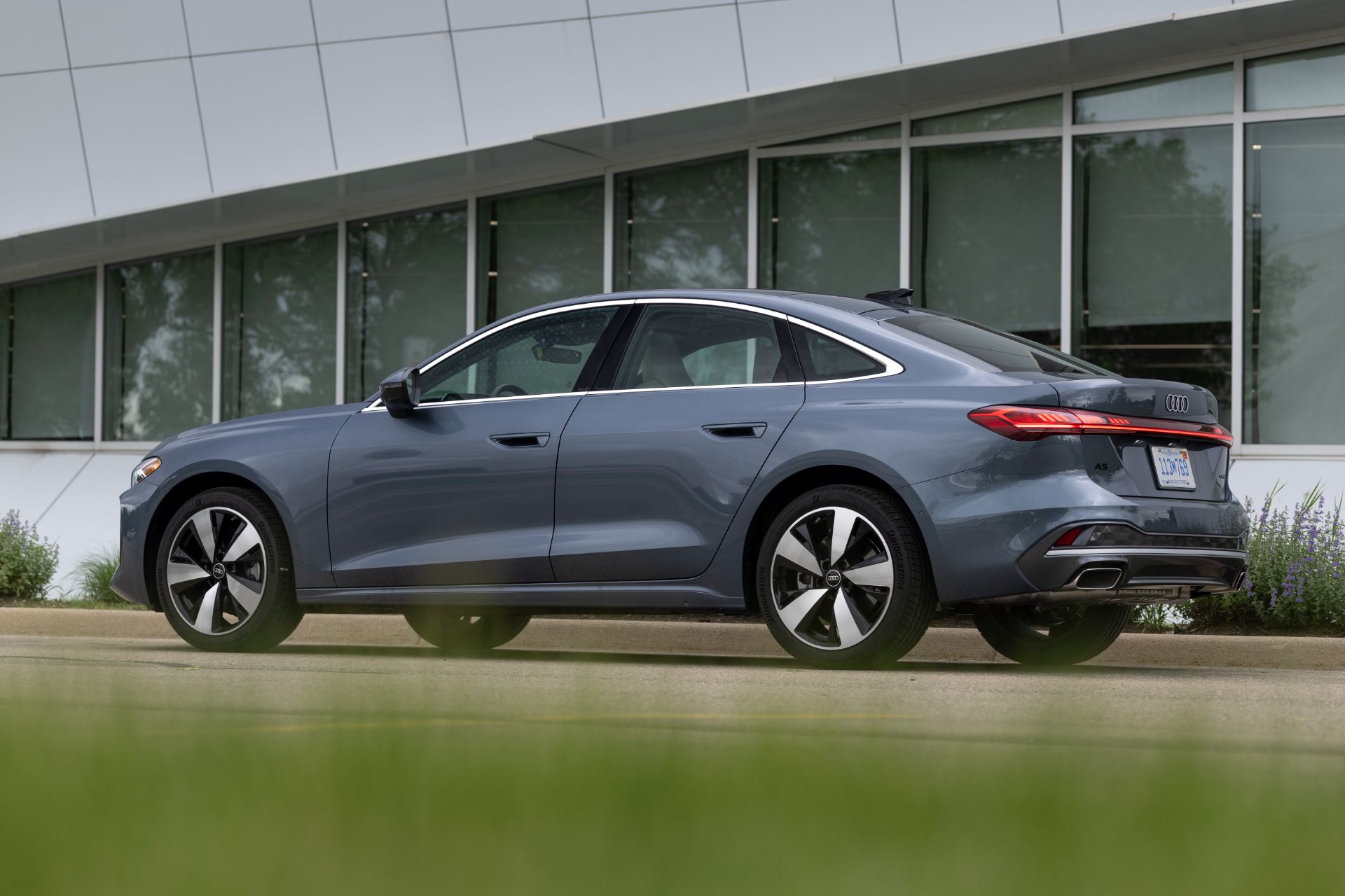 2026 audi a5 rear three quarter building blue grey