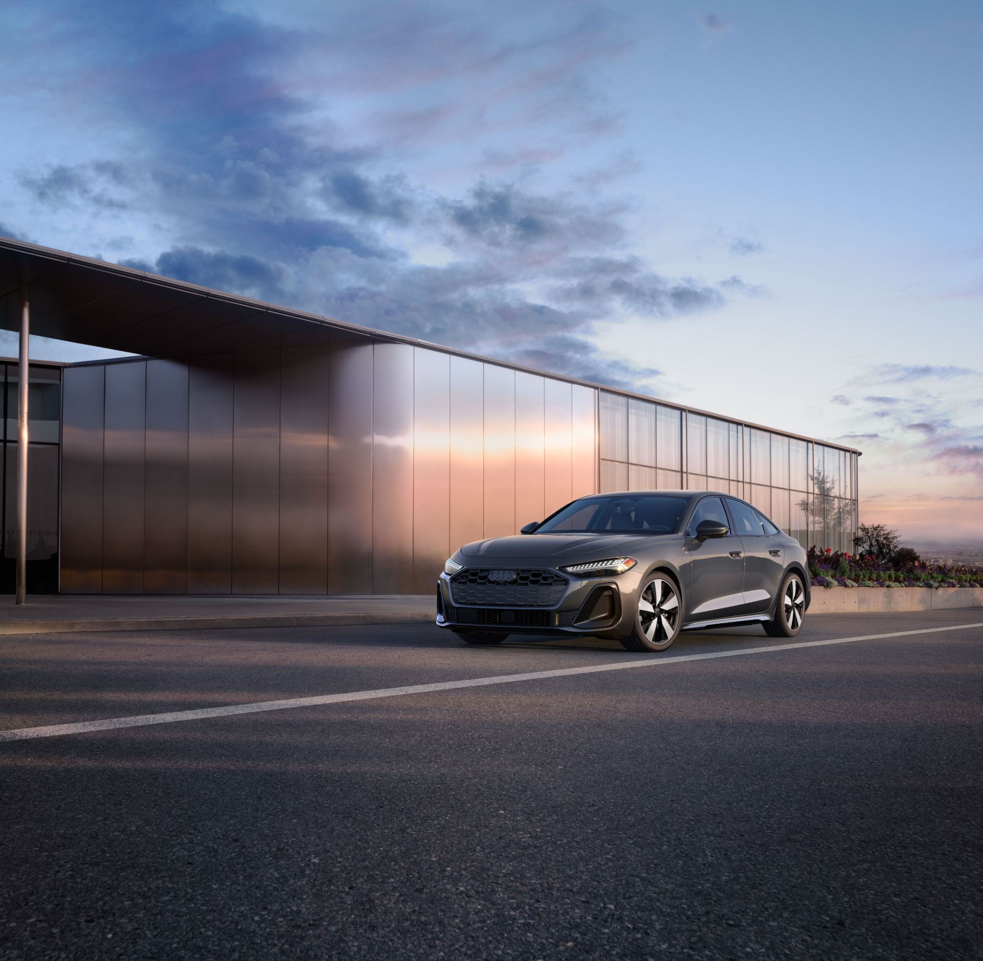 2026 audi a5 front three quarter building dusk grey