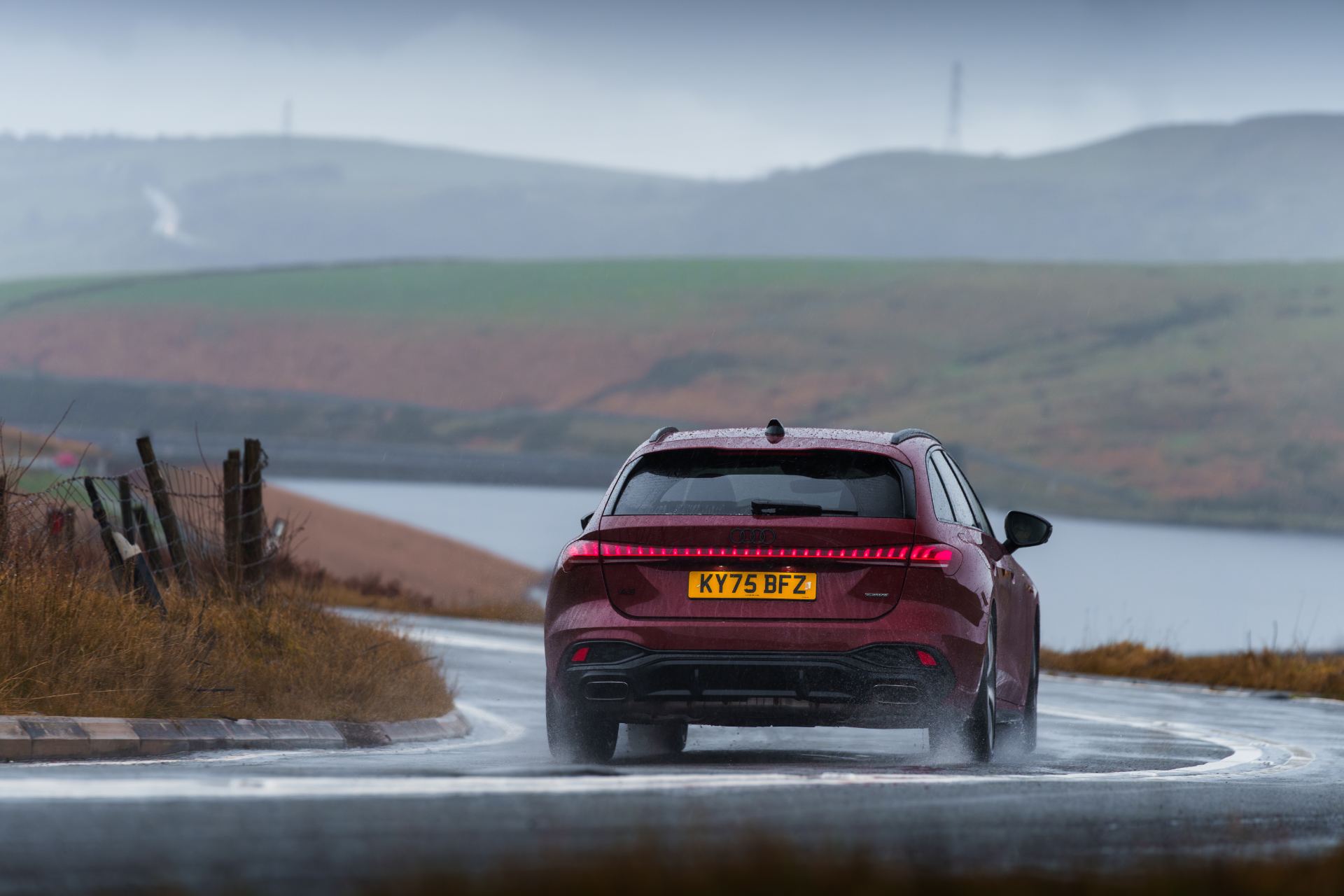 audi a5 avant driving rear hairpin red