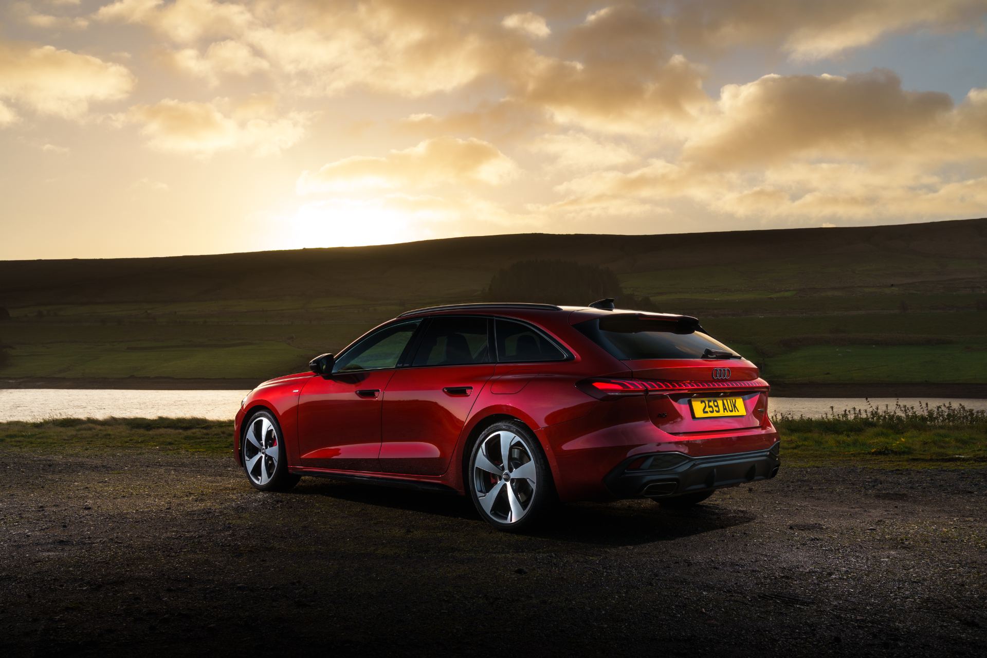 audi a5 avant rear three quarter sunset red