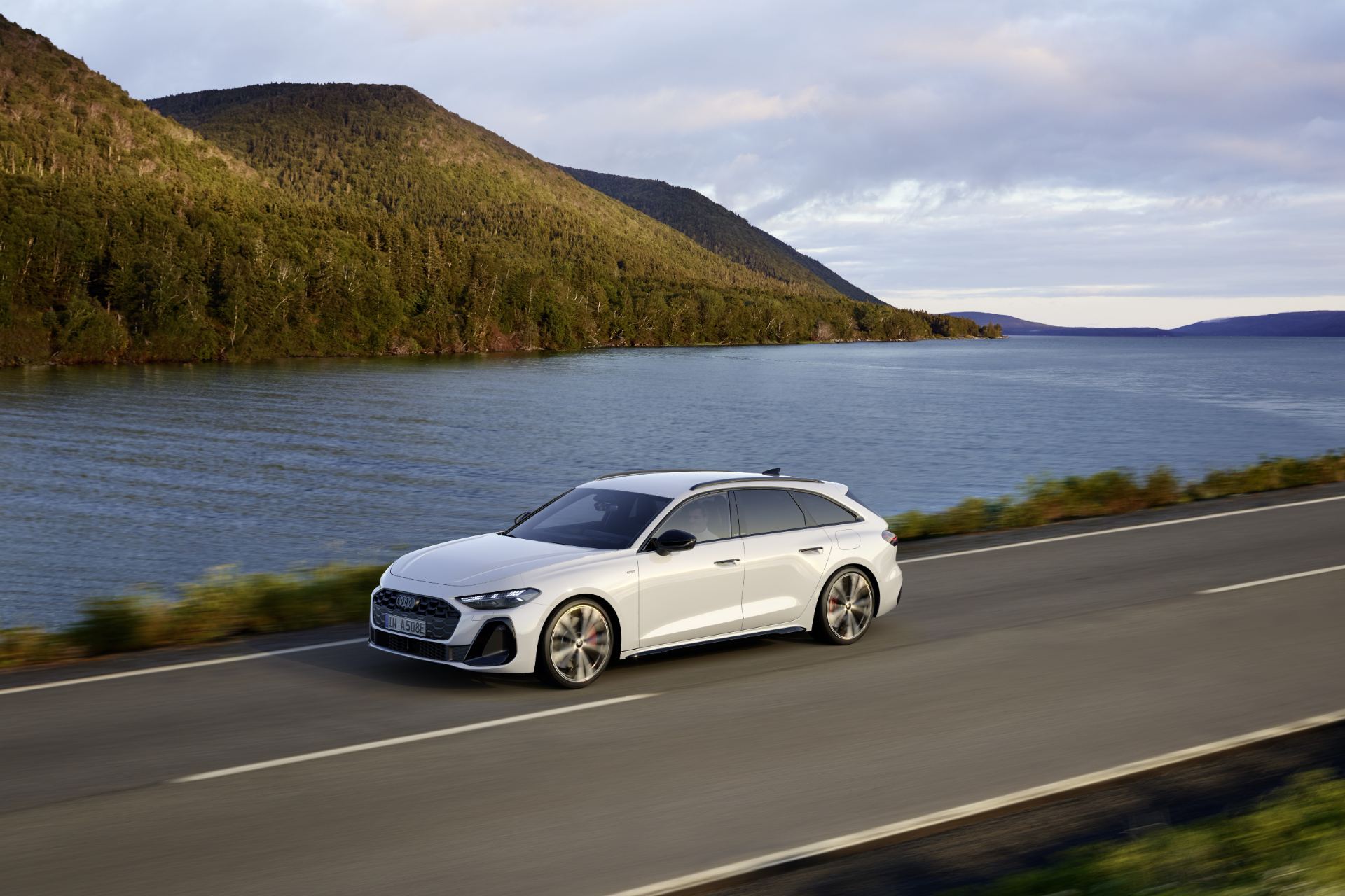 2026 audi a5 avant driving front three quarter lakeside white