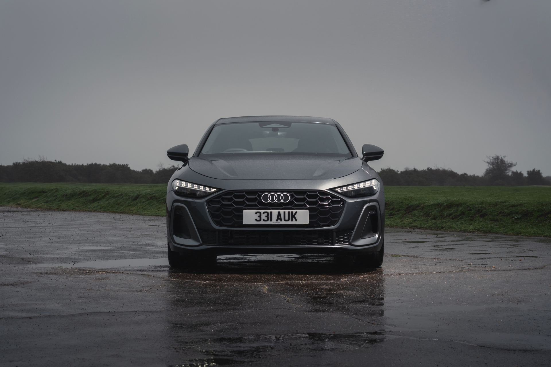 2026 audi a5 saloon e hybrid front wet airfield grey