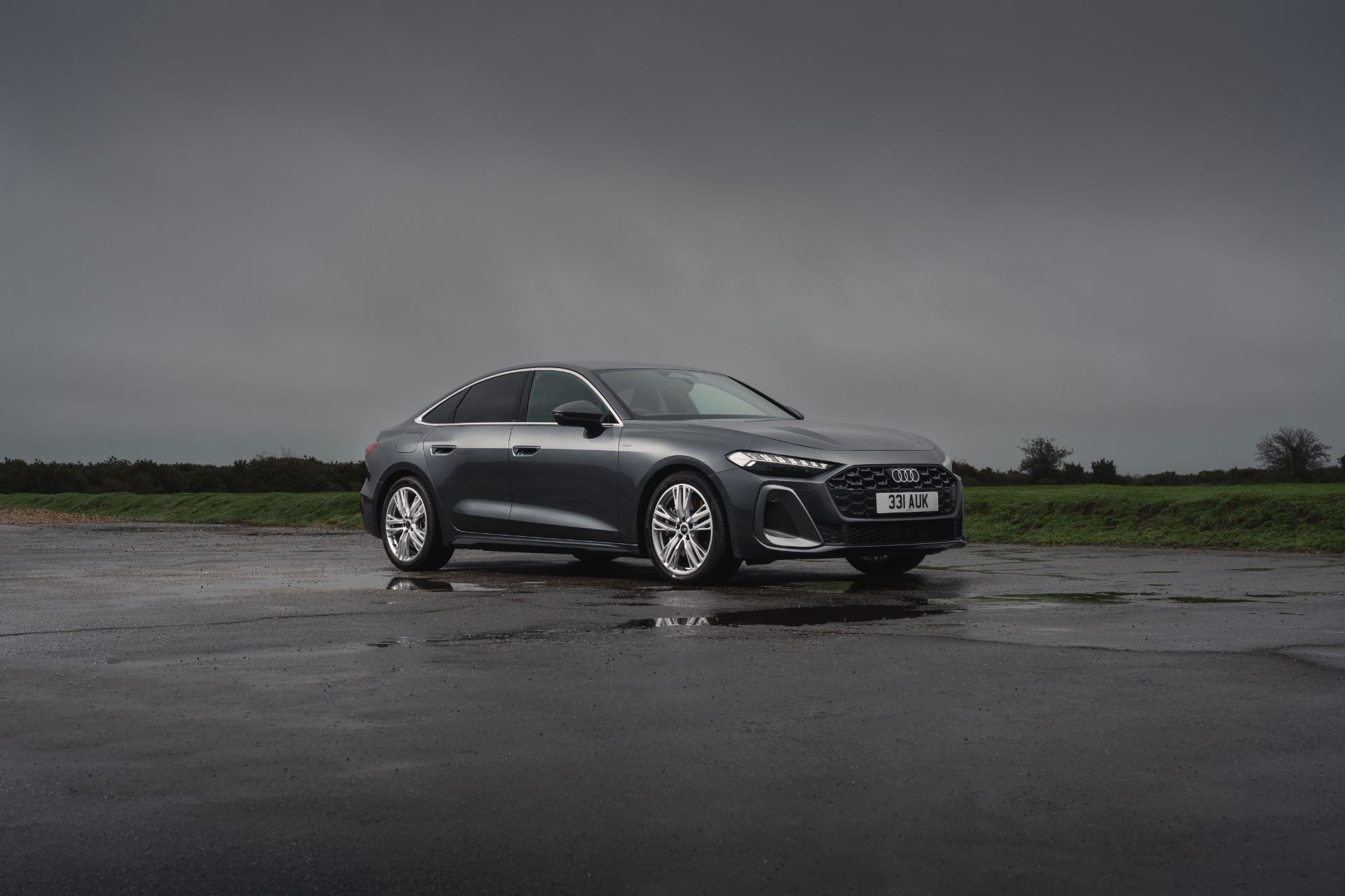 2026 audi a5 saloon front three quarter wet airfield grey