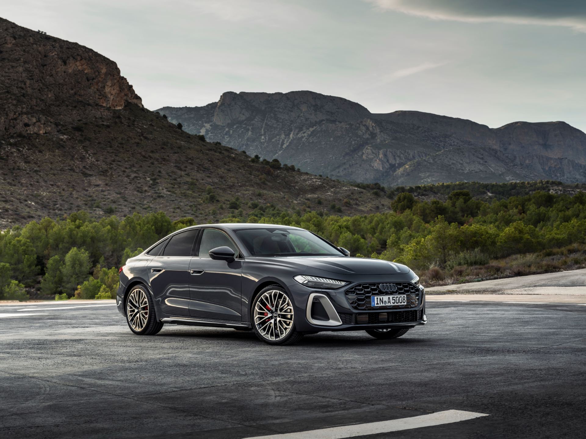 2026 audi a5 saloon front three quarter mountains grey