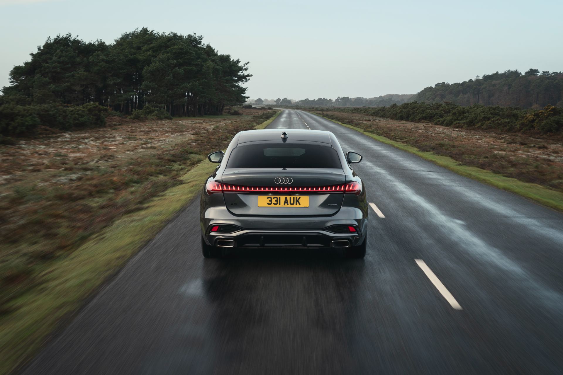 2026 audi a5 saloon driving rear heath road grey