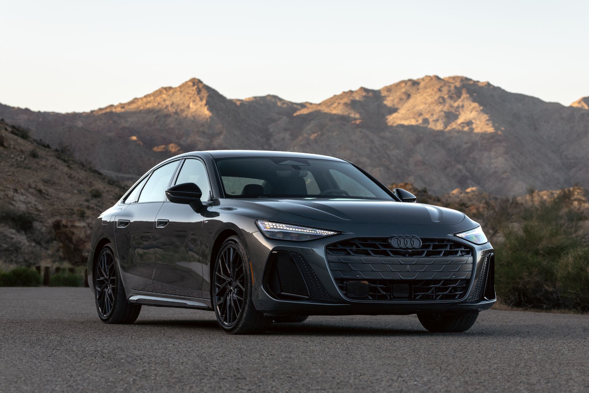 2026 audi a6 front three quarter mountains grey