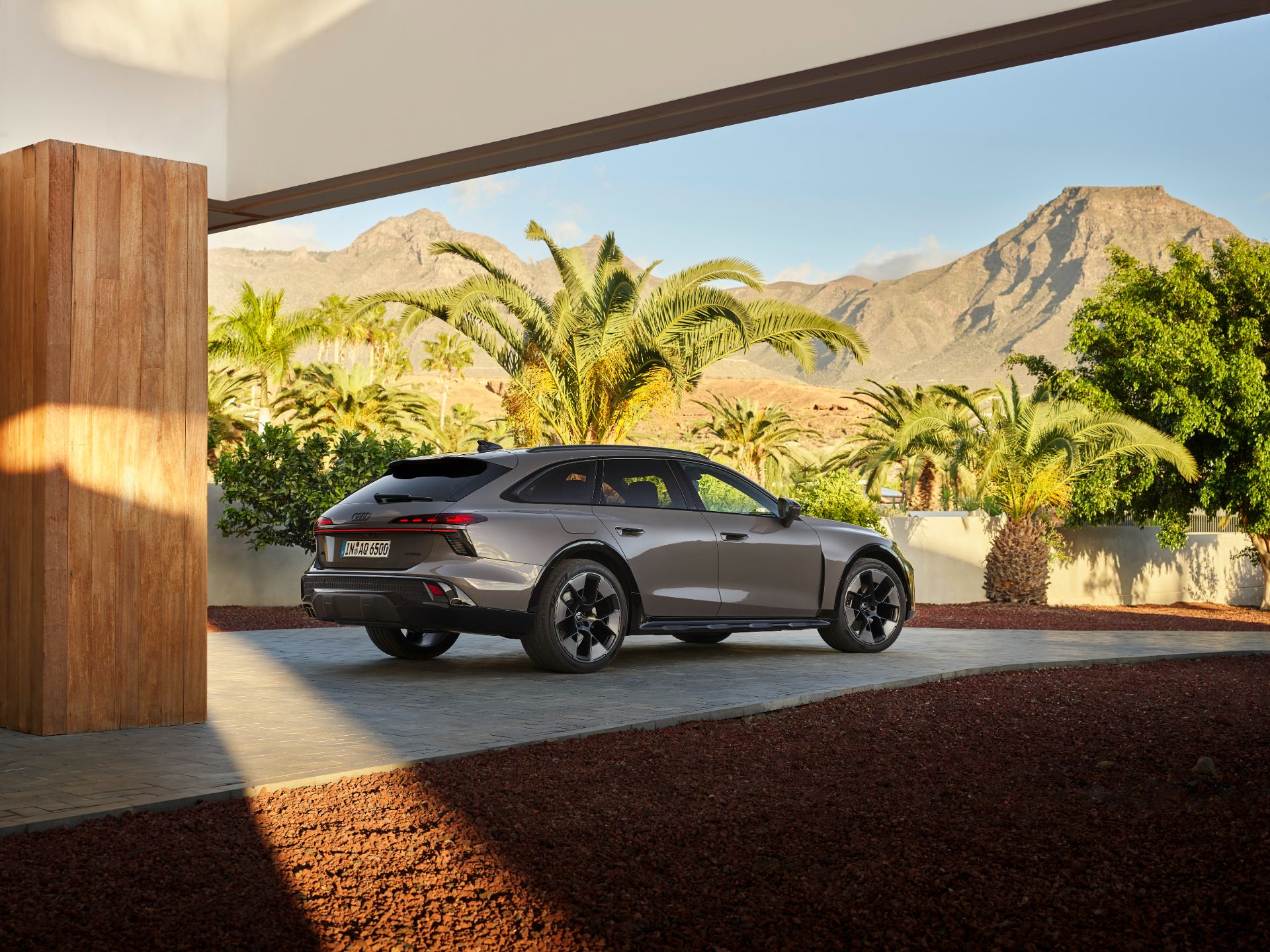2026 audi a6 allroad rear three quarter carport mountains grey