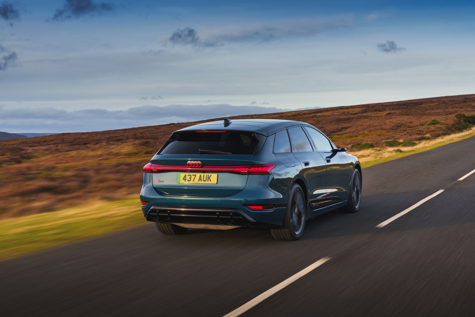 2026 audi a6 avant e tron driving rear blue