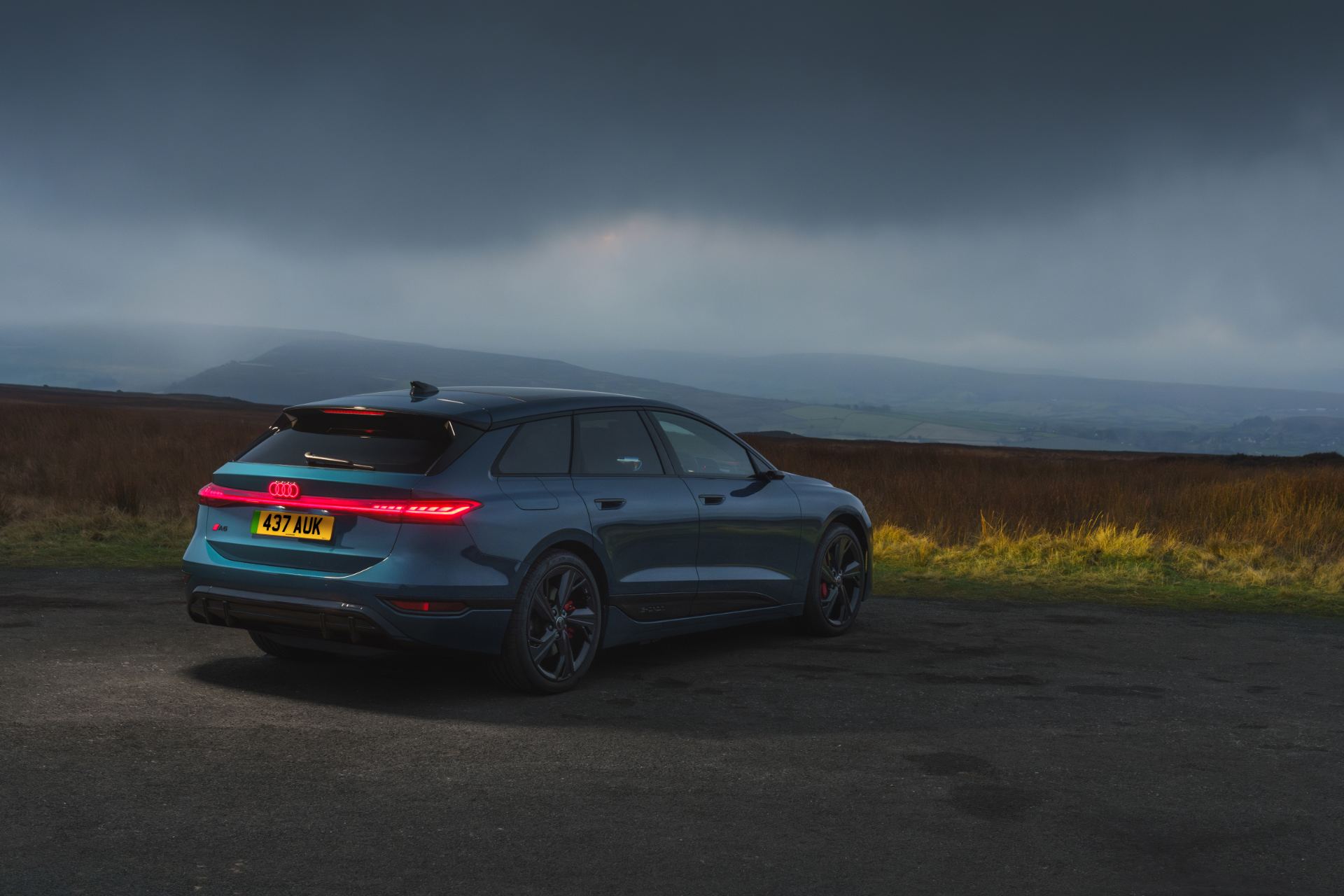 2026 audi a6 avant e tron rear three quarter stormy blue