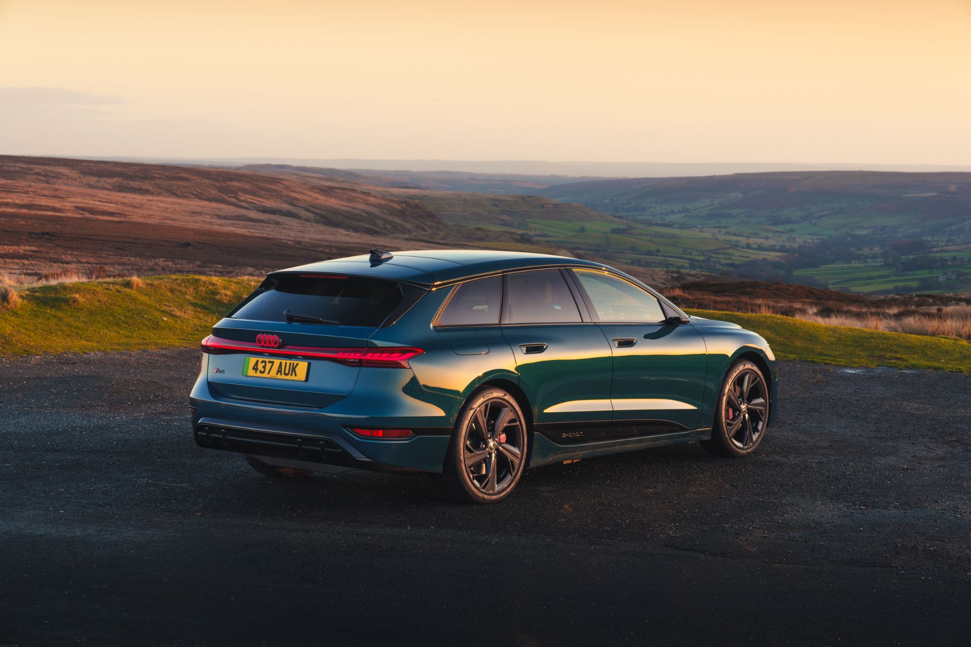 2026 audi a6 avant e tron rear three quarter sunset blue