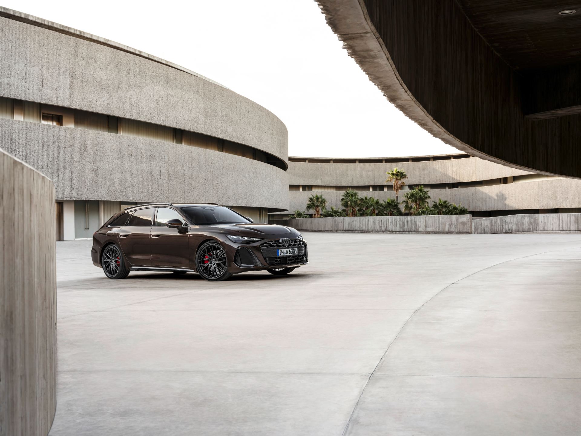 2026 audi a6 avant front three quarter courtyard brown