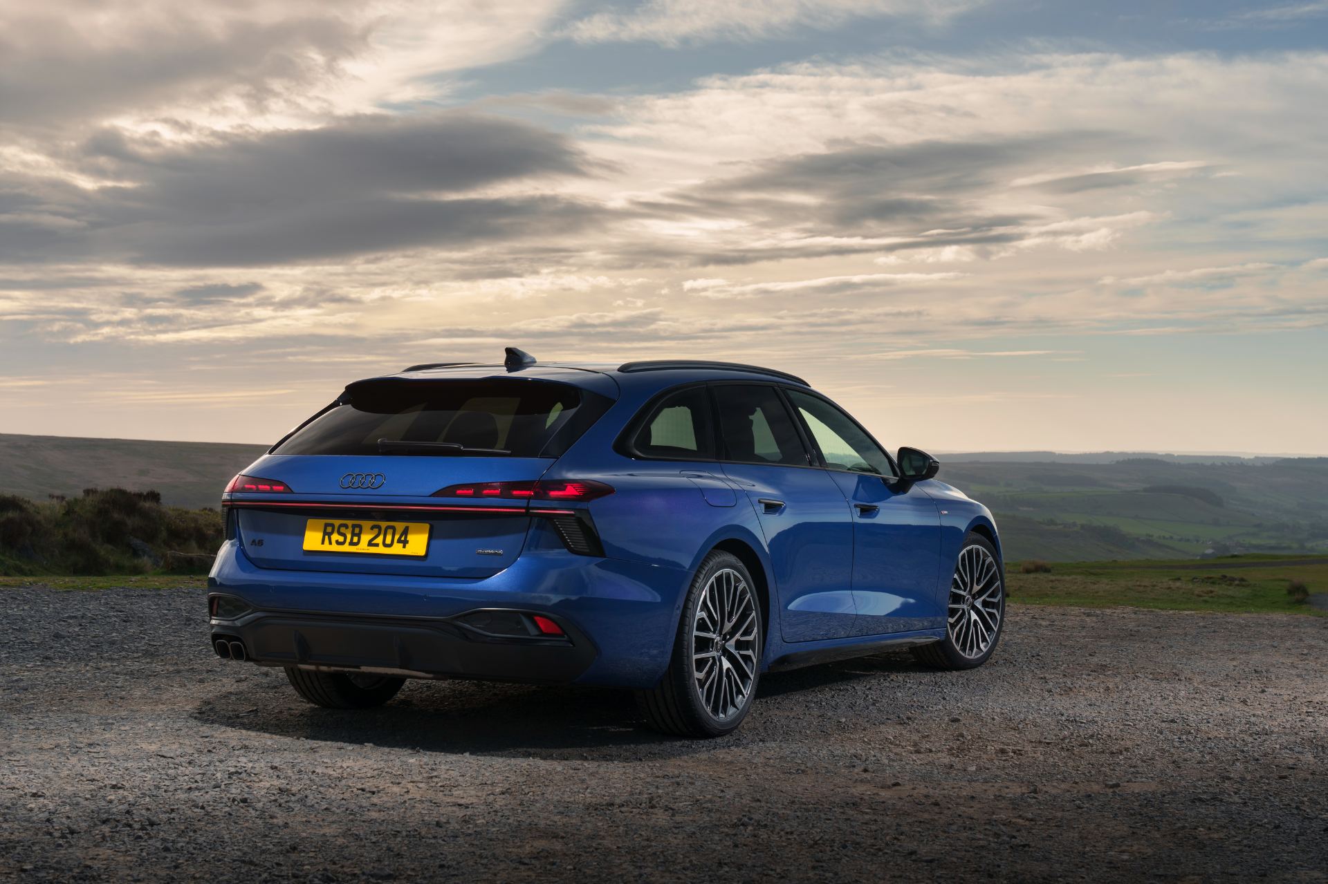 2026 audi a6 avant rear three quarter moorland blue