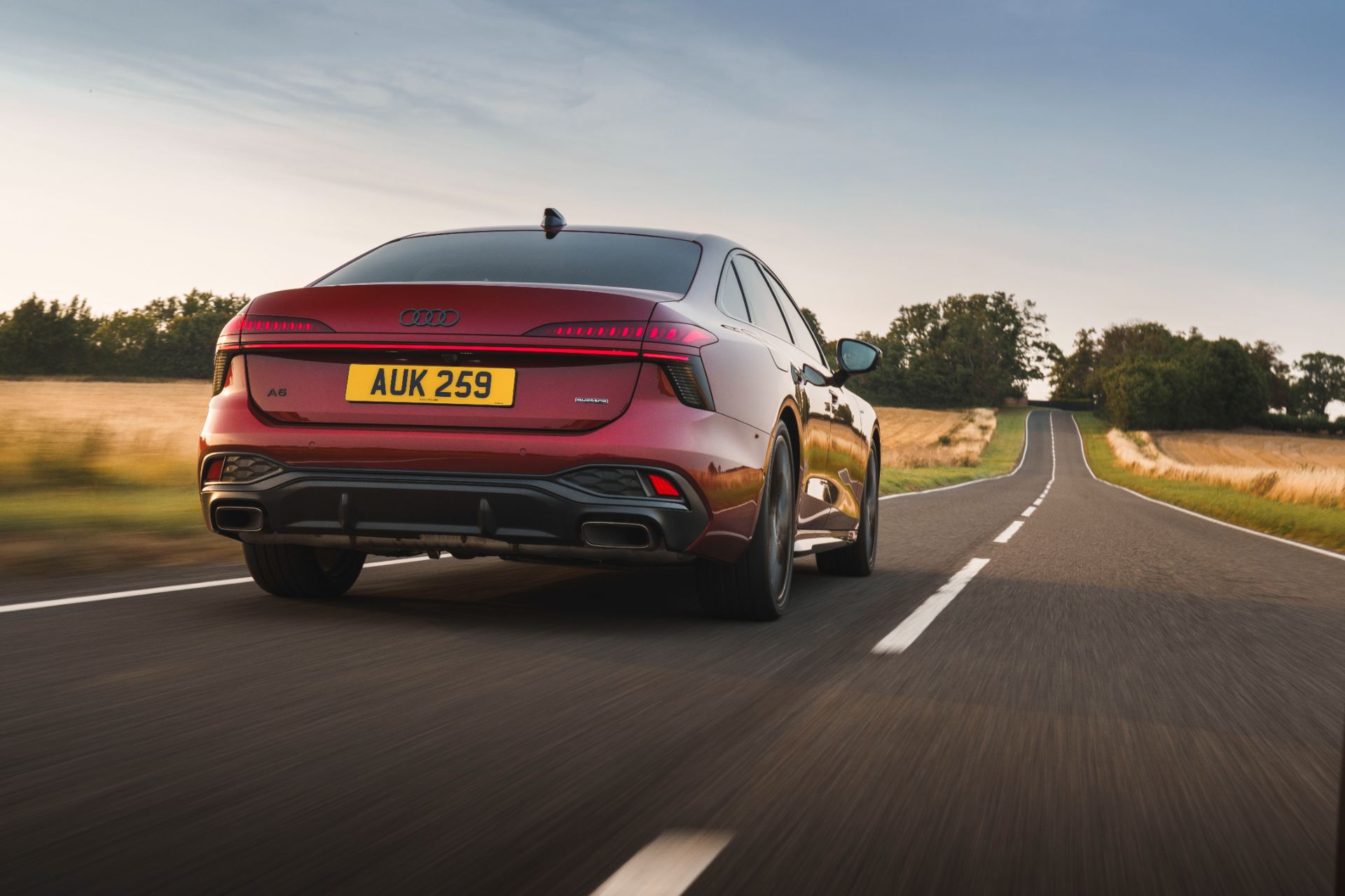 2026 audi a6 saloon e hybrid driving rear red