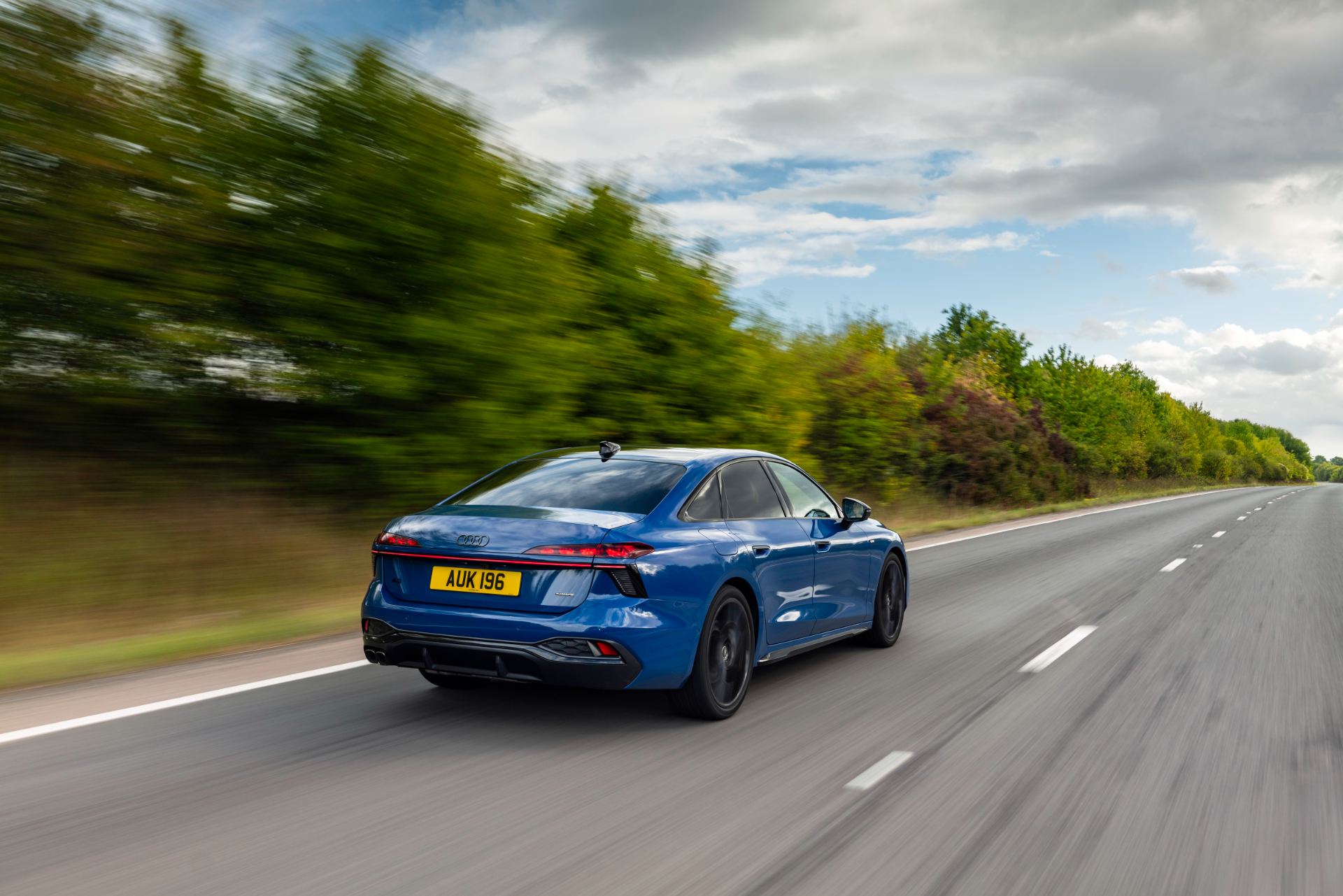 2026 audi a6 saloon driving rear three quarter blue