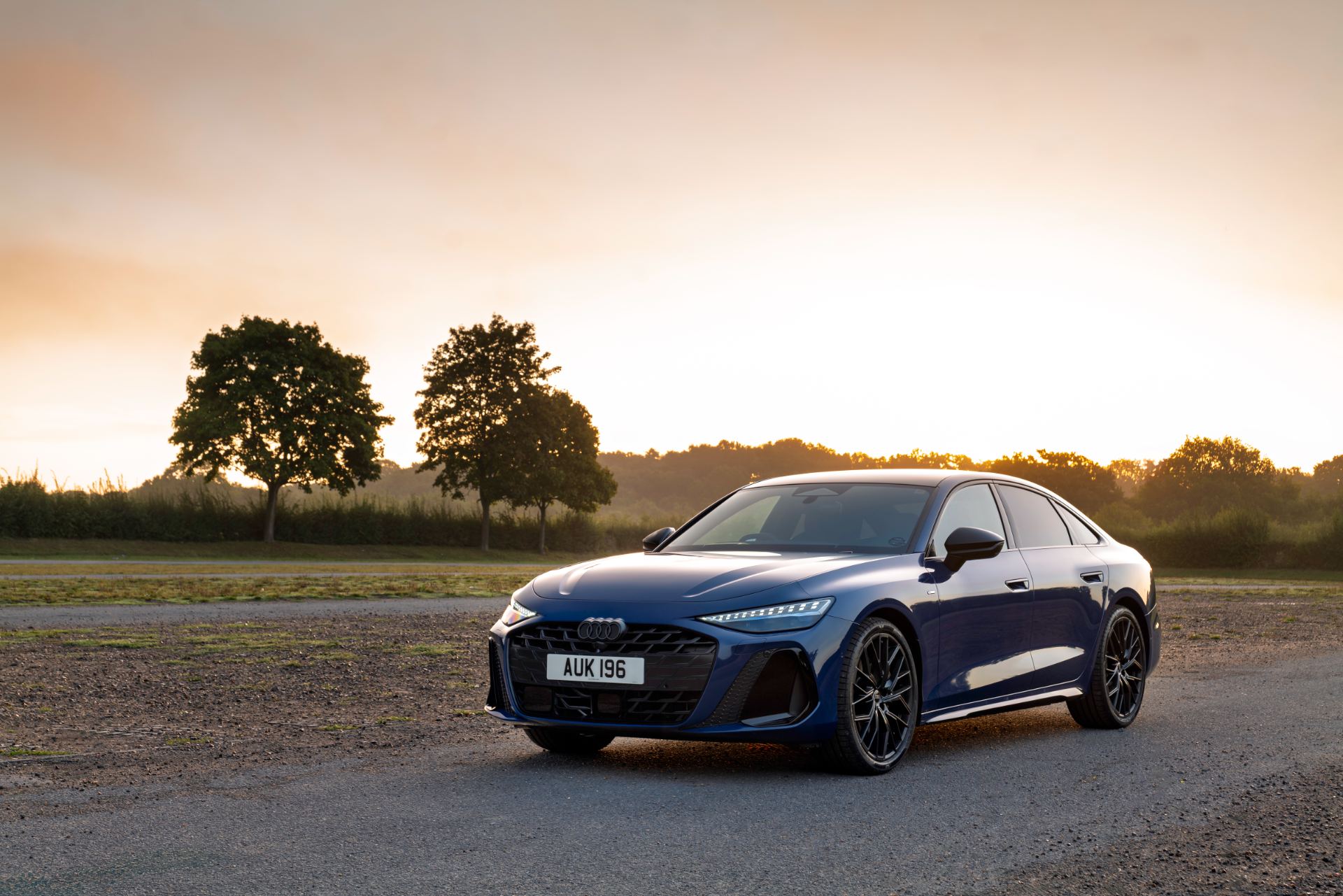 2026 audi a6 saloon front three quarter sunset blue