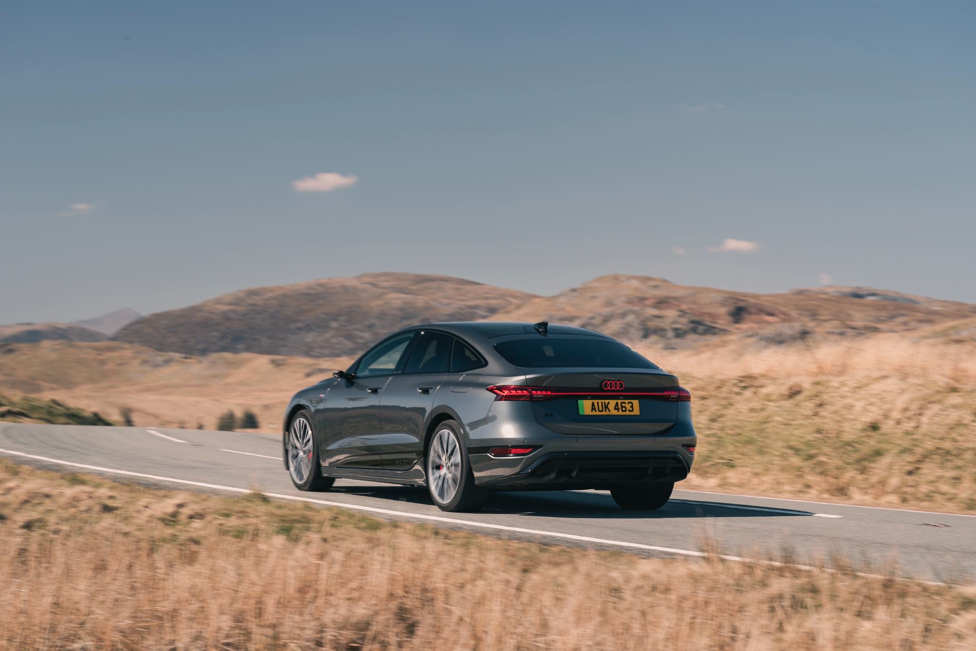 2026 audi a6 sportback e tron driving rear three quarter grey