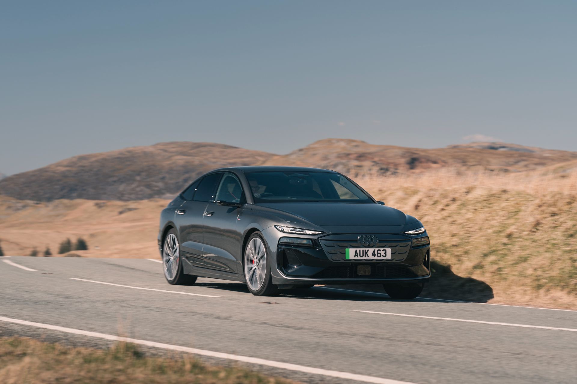 2026 audi a6 sportback e tron driving front three quarter grey