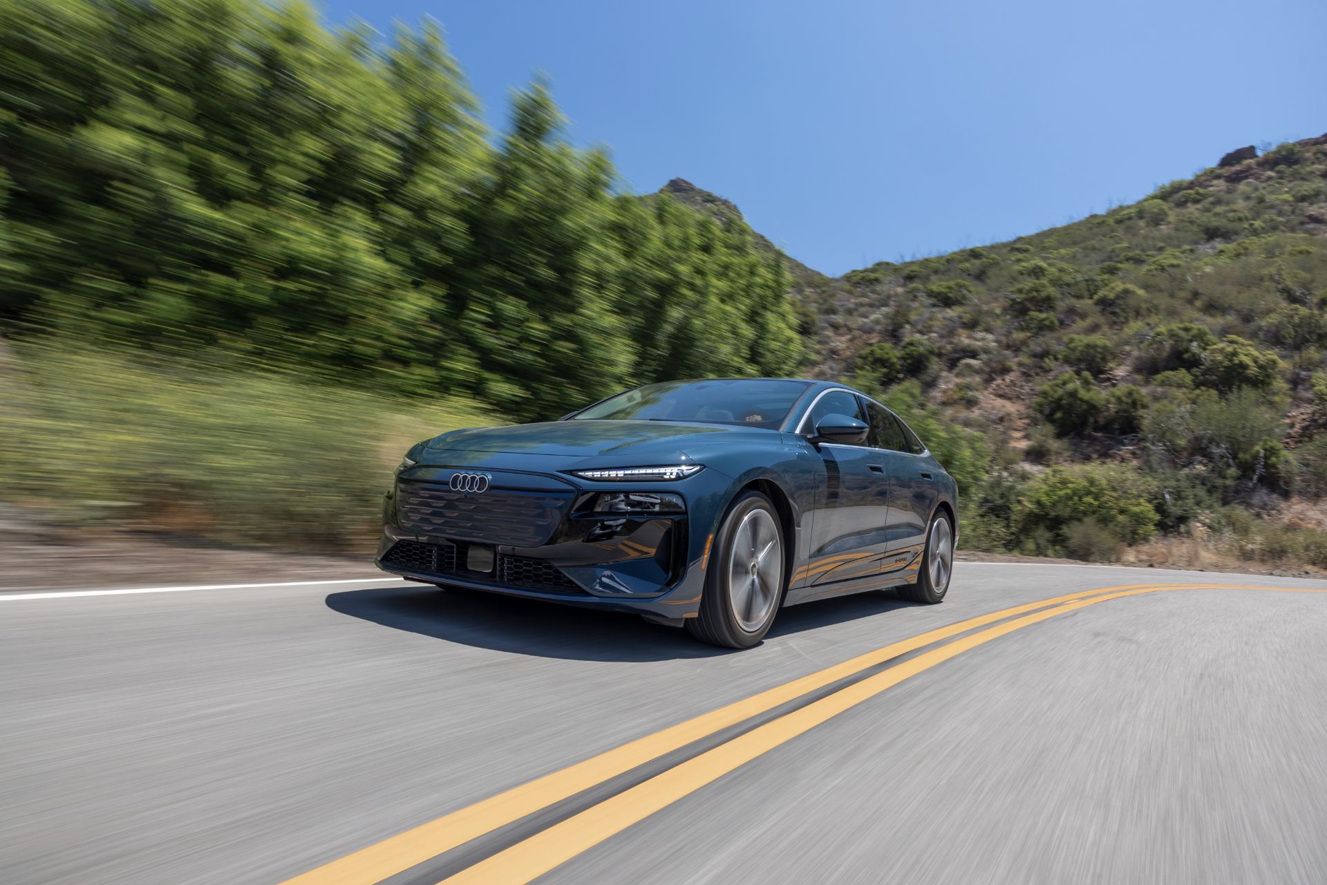 2027 audi a6 sportback e tron driving front three quarter grey