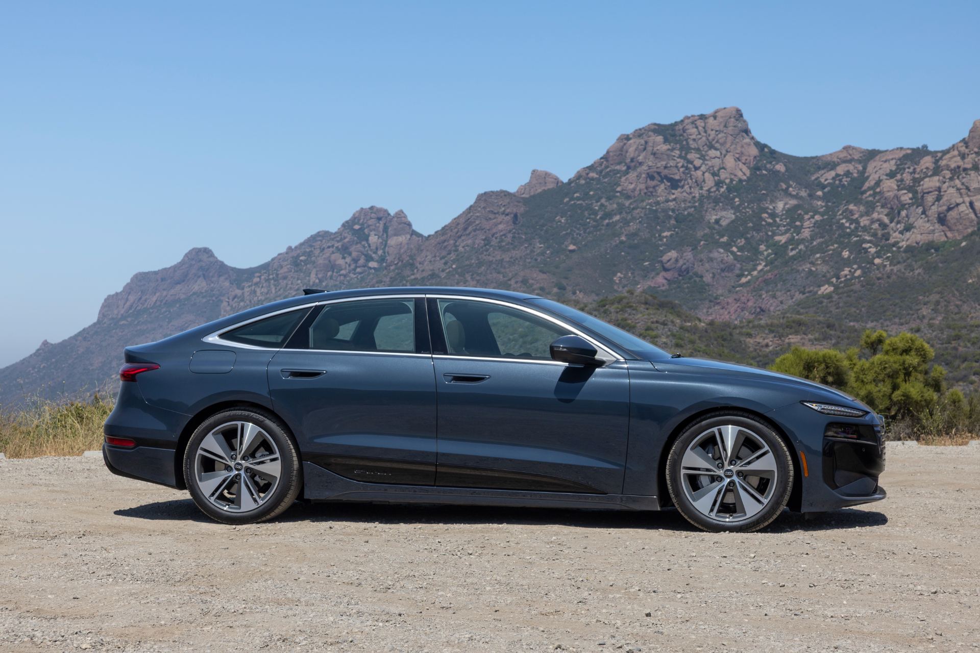 2027 audi a6 sportback e tron side profile mountains grey