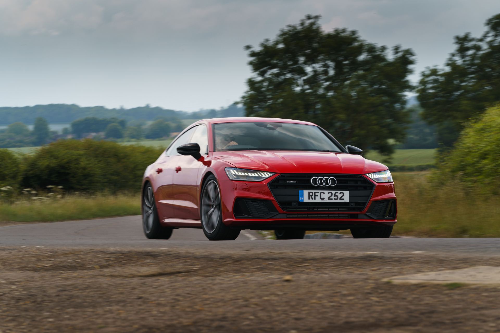 2025 audi a7 sportback front three quarter corner red