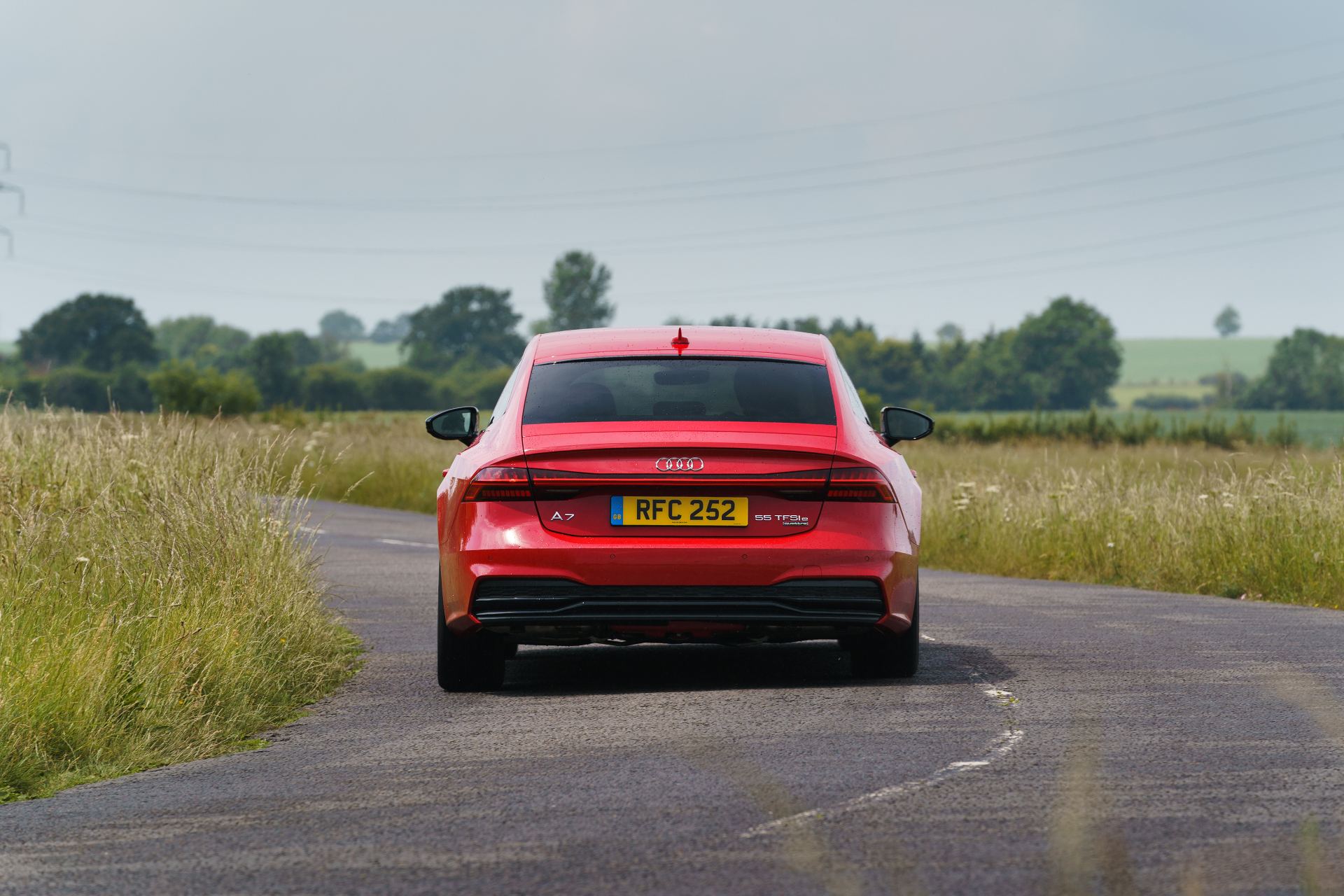 2025 audi a7 sportback rear country lane red