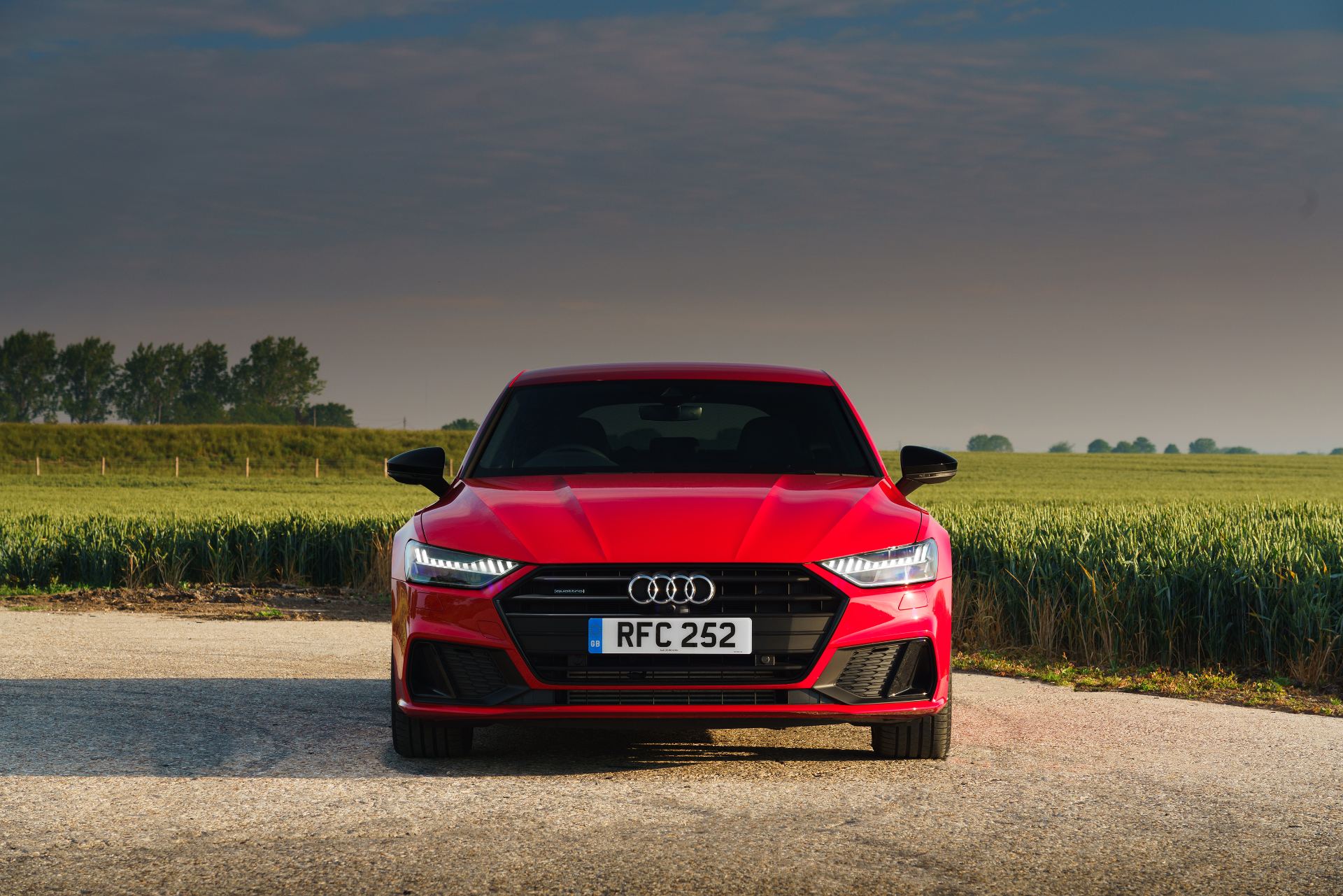 2025 audi a7 sportback front wheat field red
