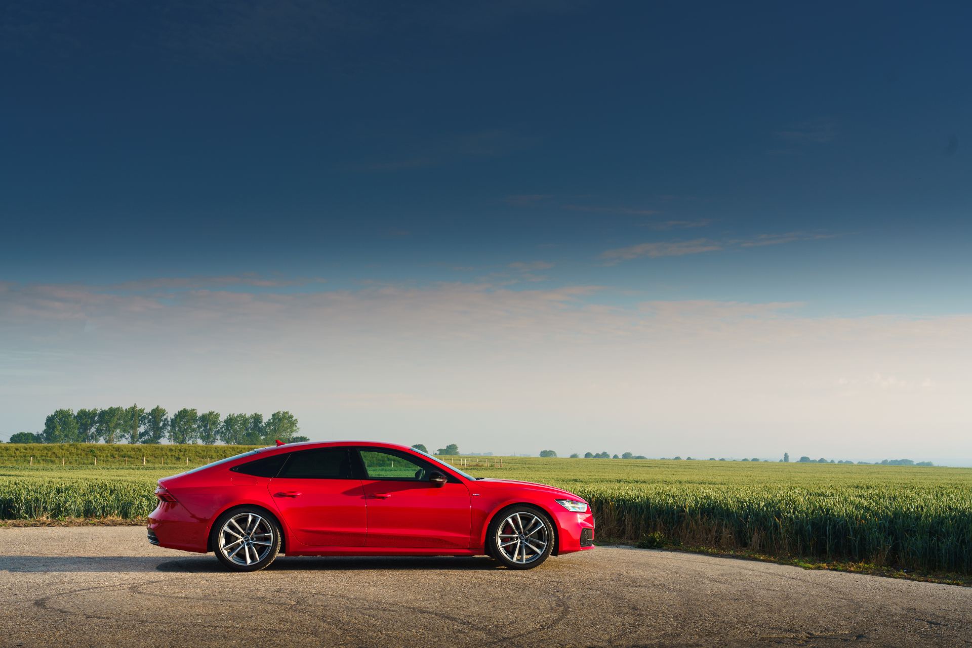 2025 audi a7 sportback side profile wheat field red