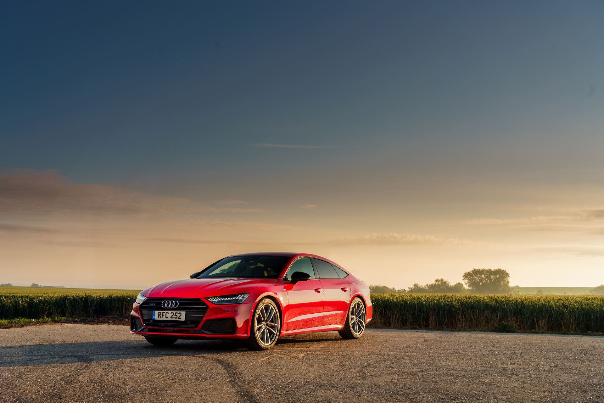 2025 audi a7 sportback front three quarter dusk red