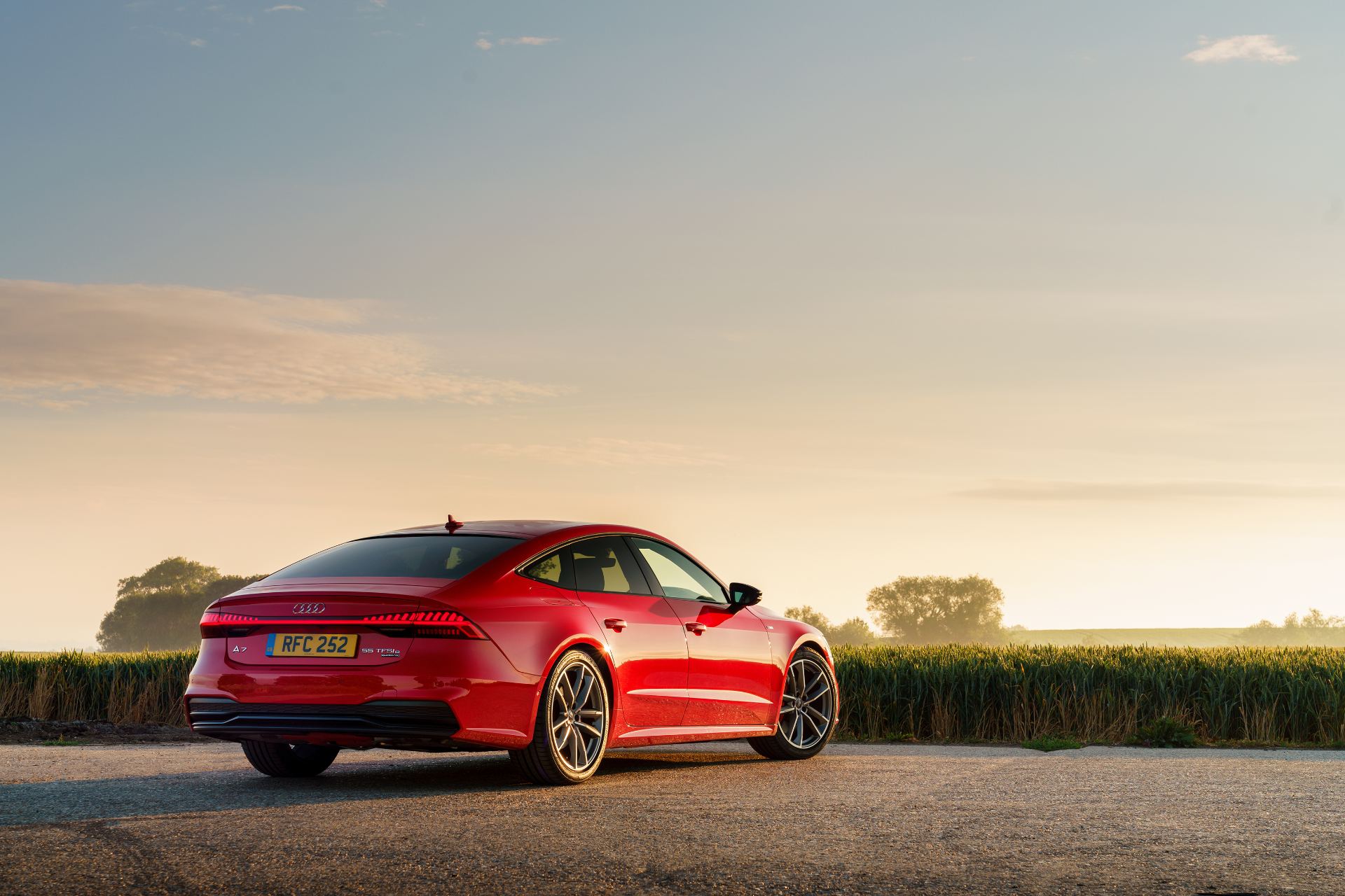 2025 audi a7 sportback rear three quarter sunrise red