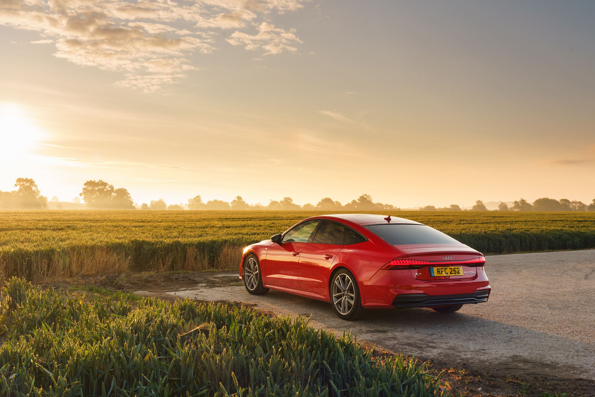 2025 audi a7 sportback rear three quarter wheat field red