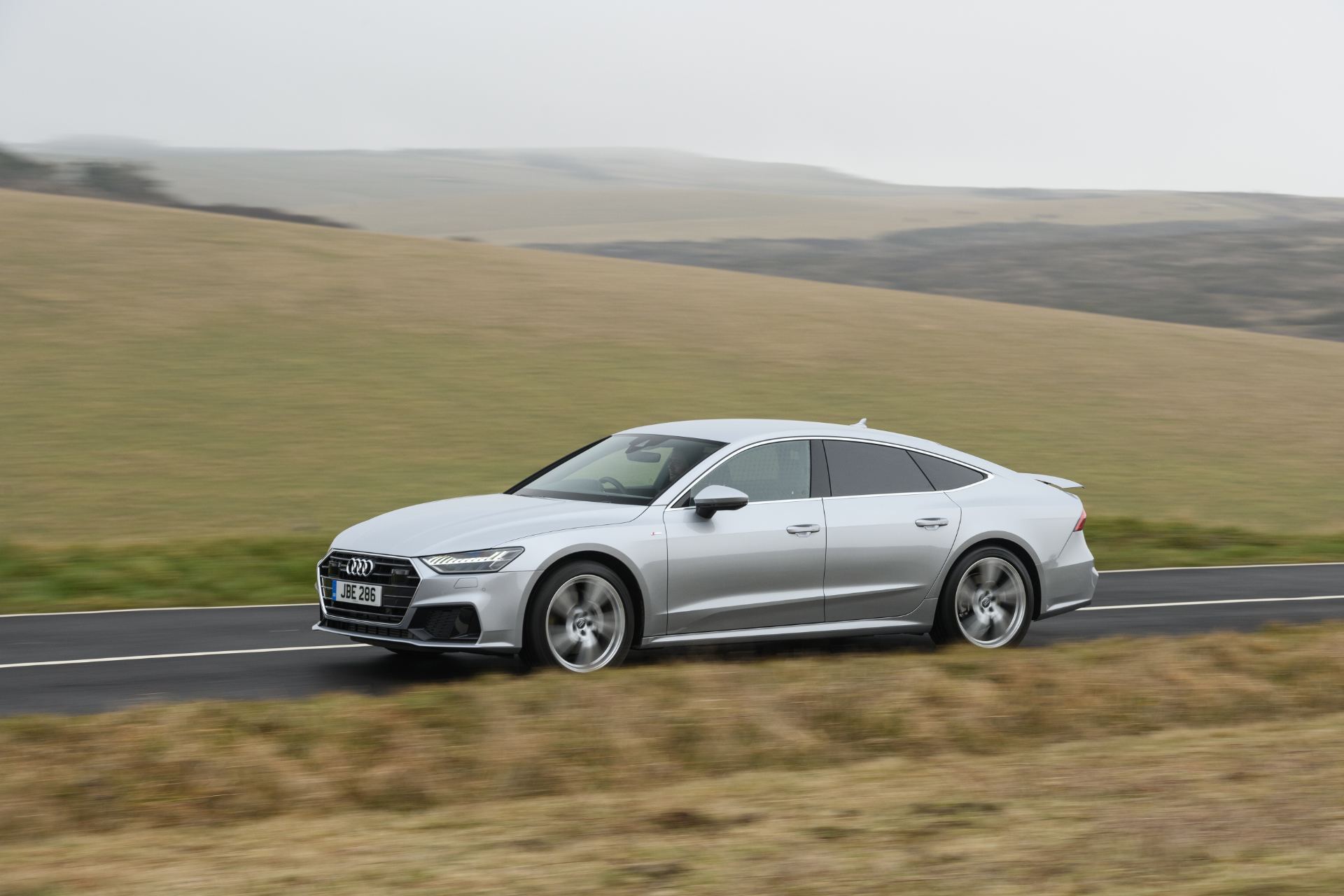 2025 audi a7 sportback driving side downs road silver