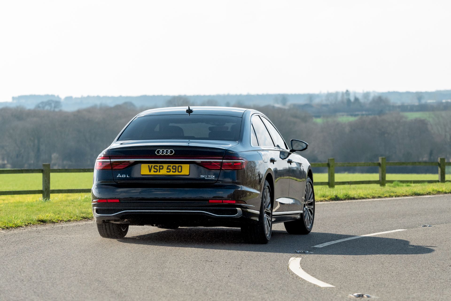 2025 audi a8 driving rear black