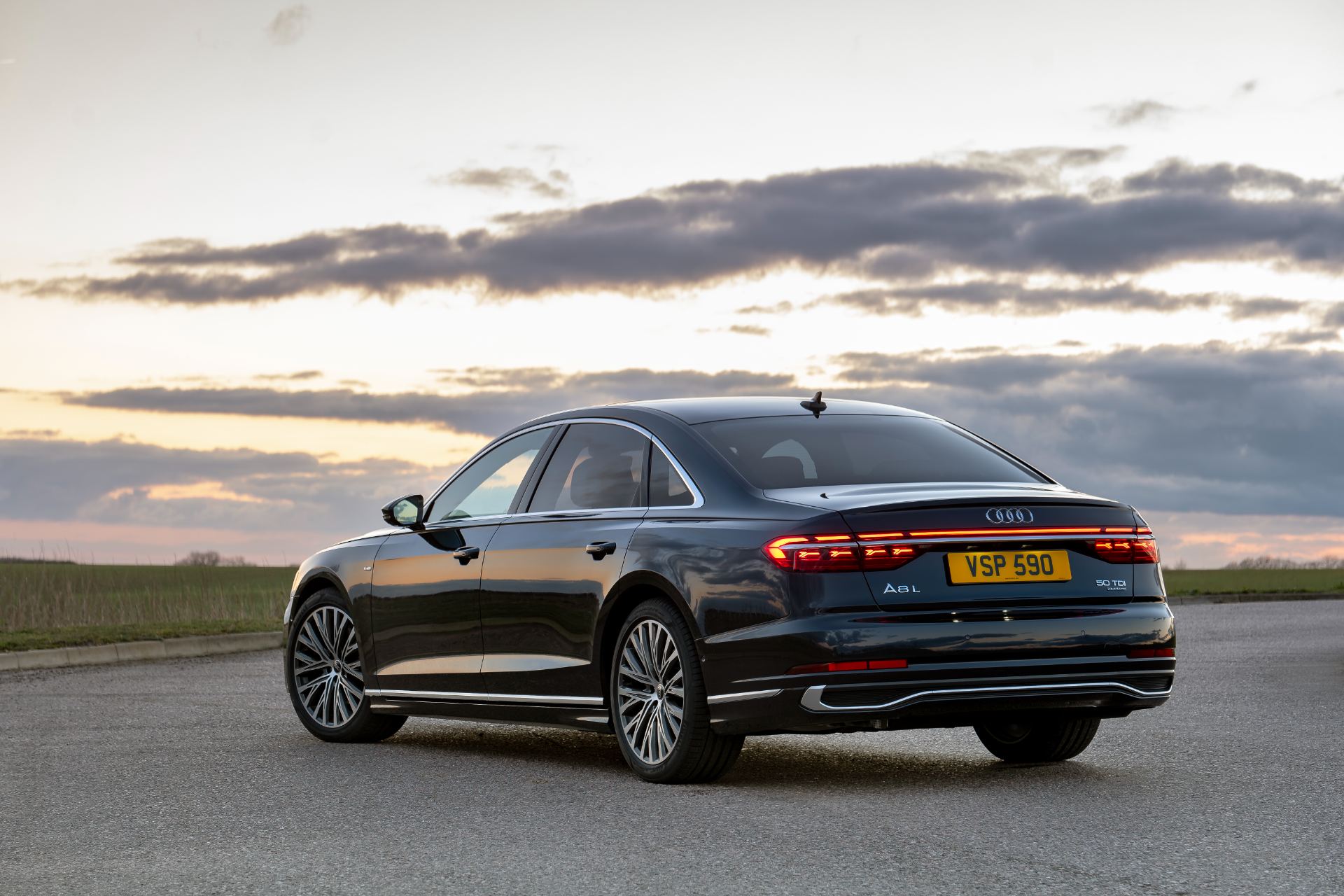 2025 audi a8 rear three quarter sunset black