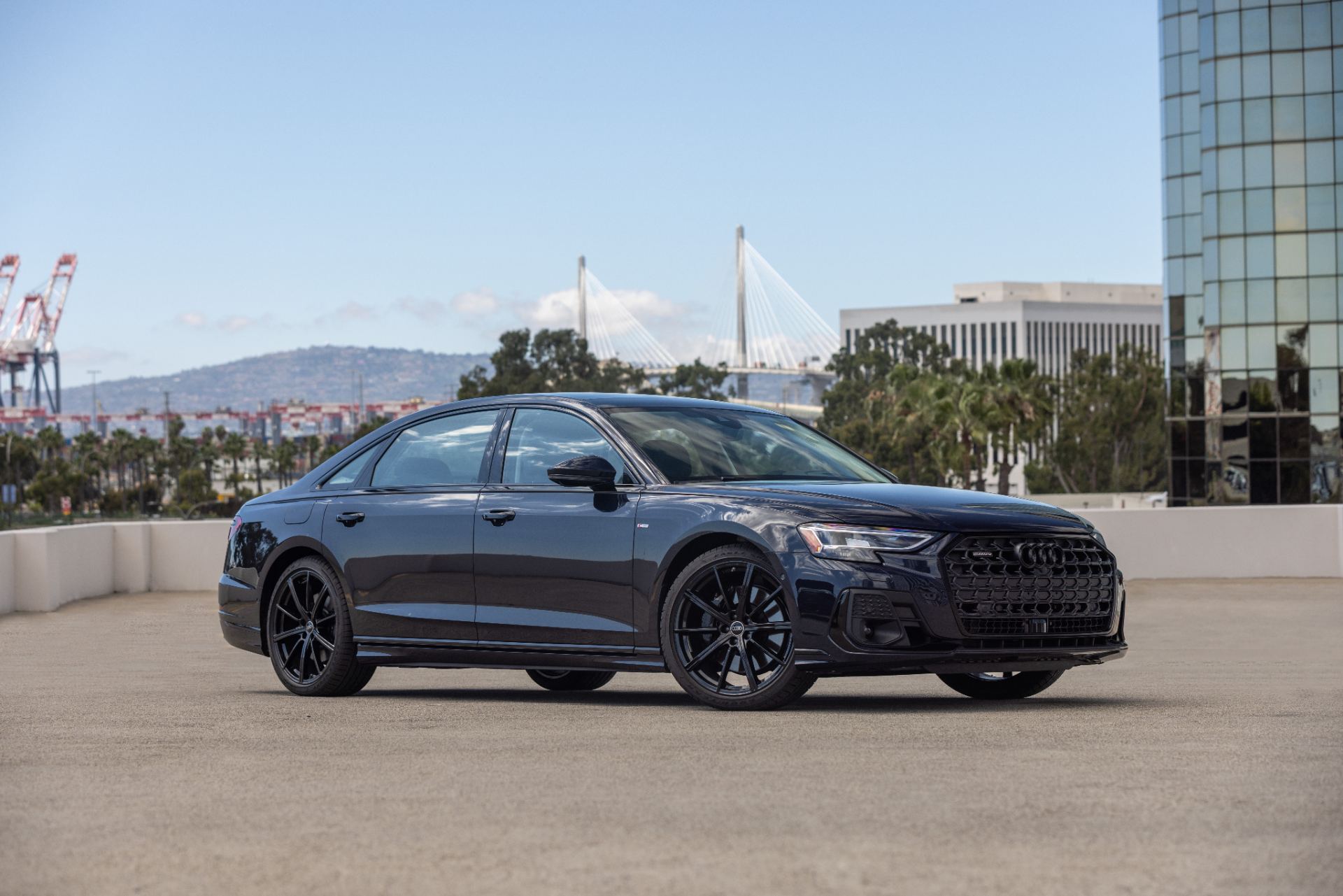 audi a8 l front three quarter parking deck dark blue