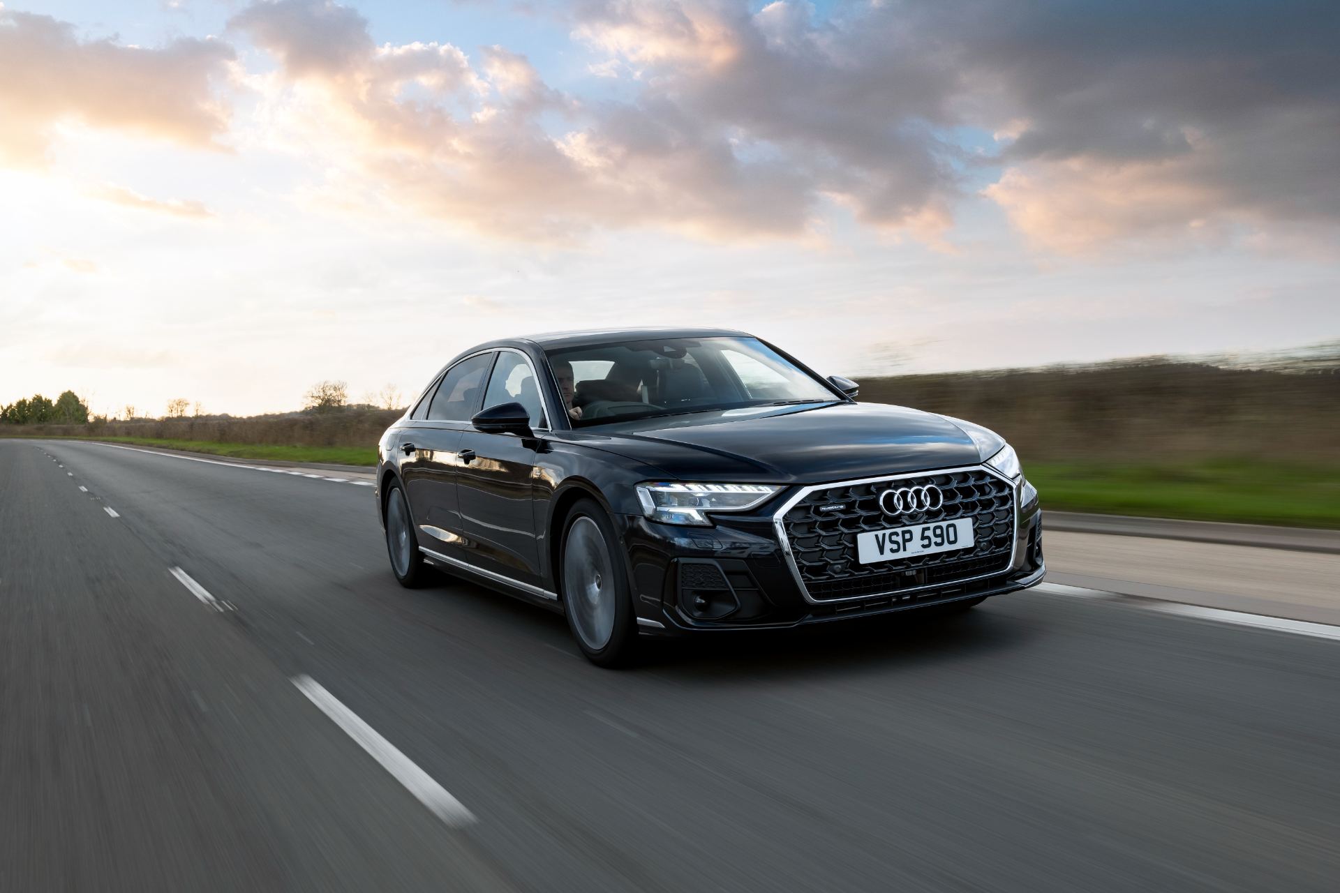 2025 audi a8 l driving front three quarter black