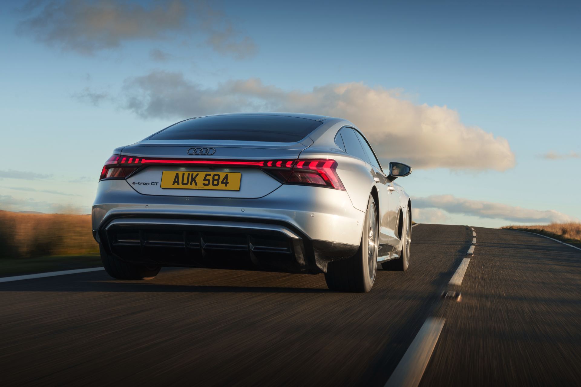 2026 audi e tron gt quattro driving rear low angle silver