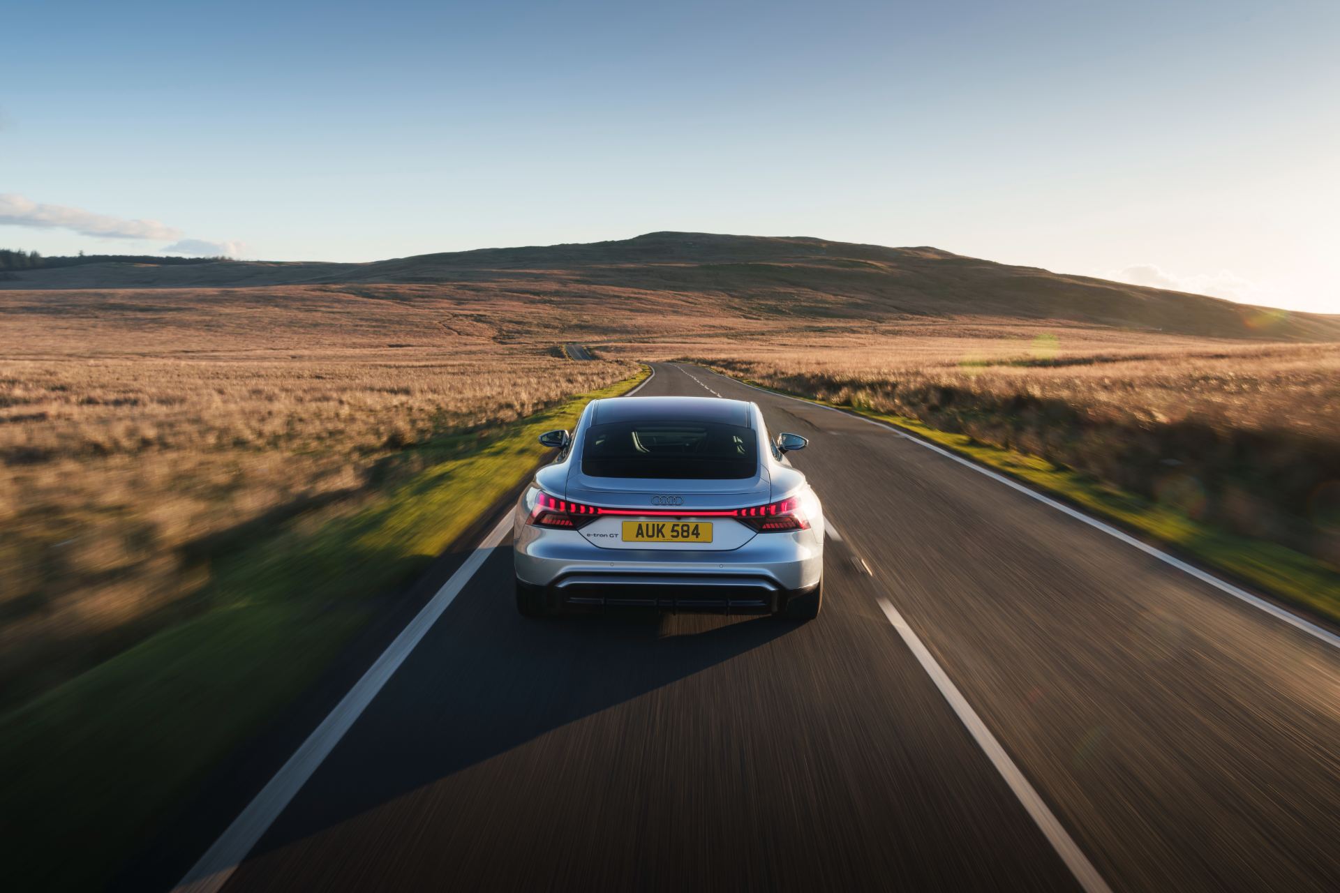 2026 audi e tron gt quattro driving rear open road silver