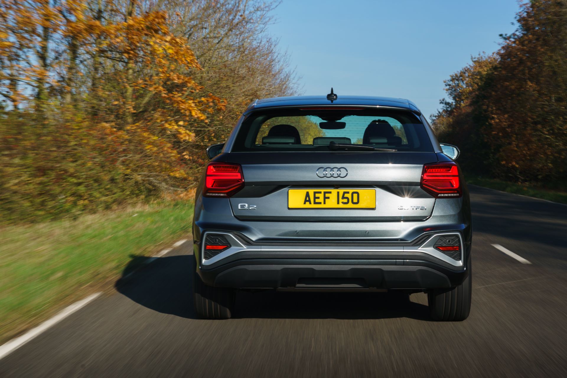 2025 audi q2 driving rear autumn road grey