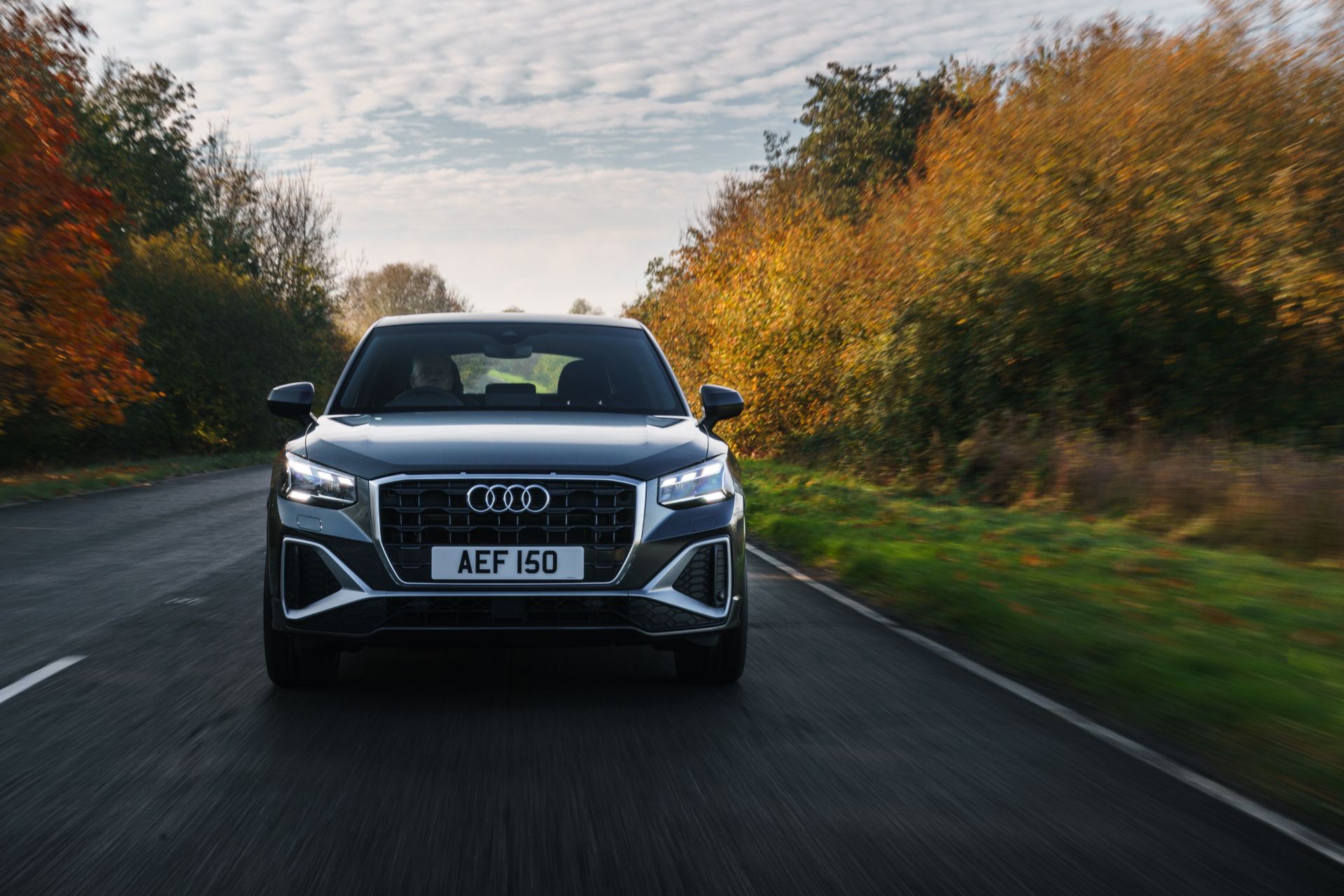 2025 audi q2 driving front autumn road grey
