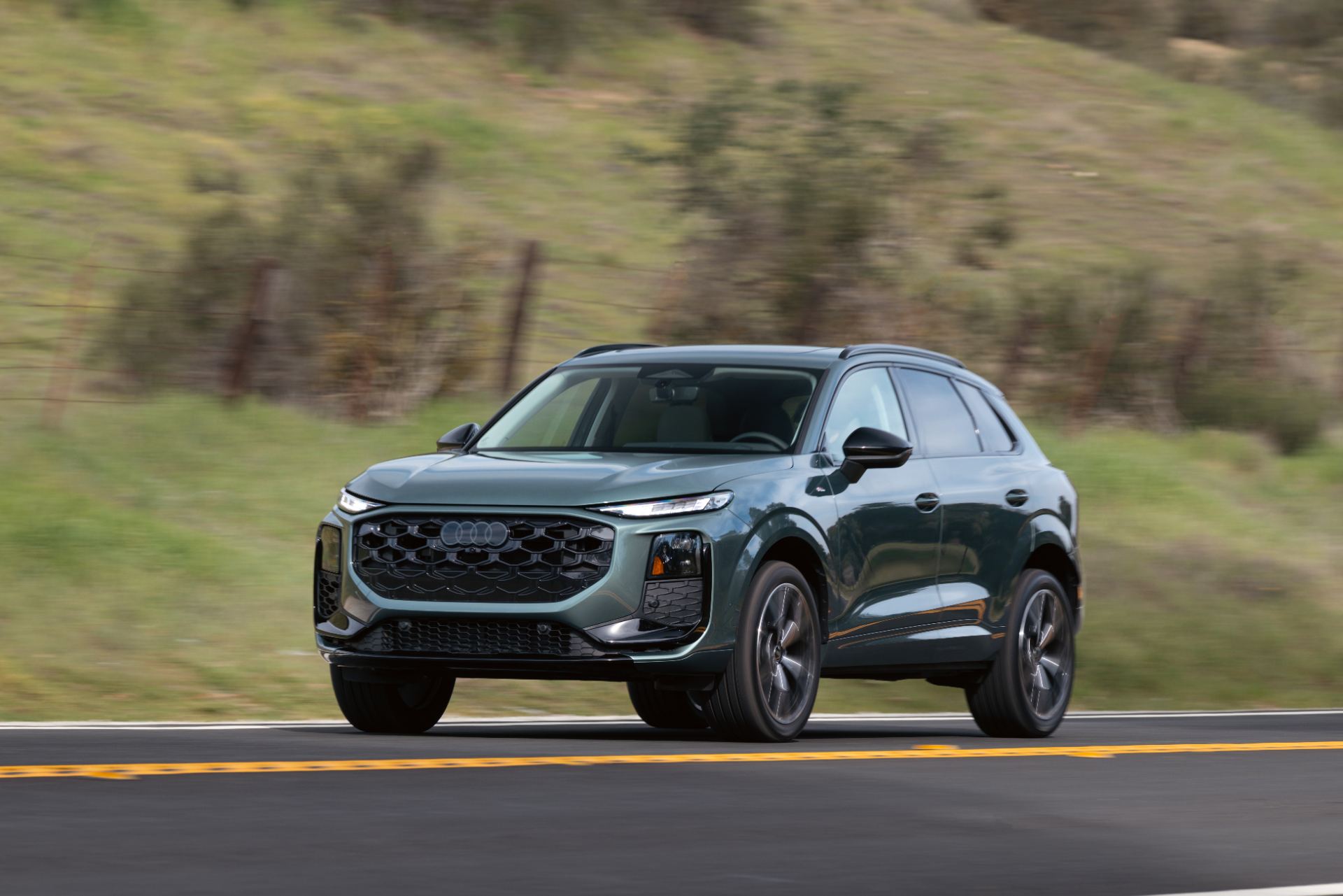 2026 audi q3 driving front three quarter sage green