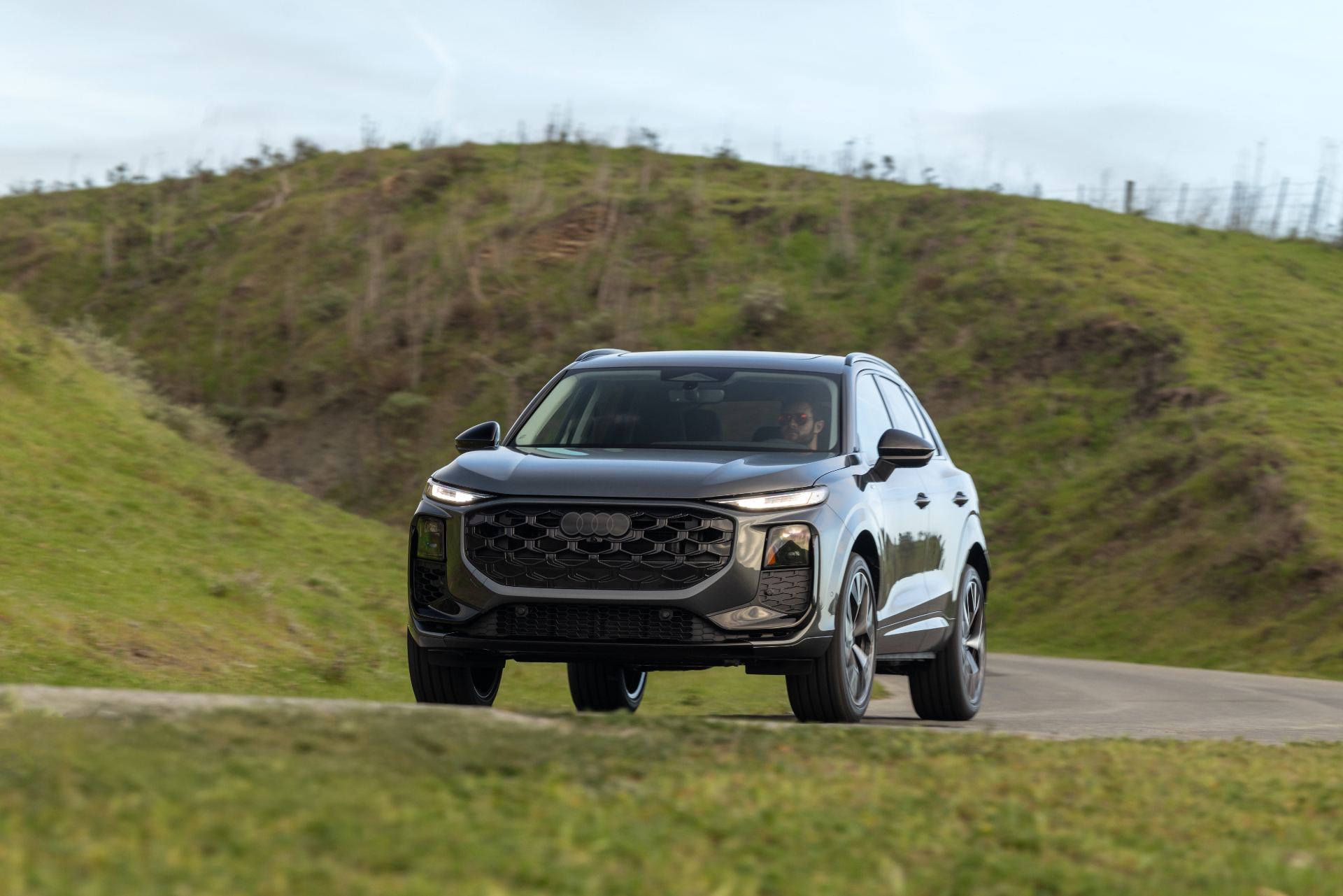 2026 audi q3 driving front hills grey