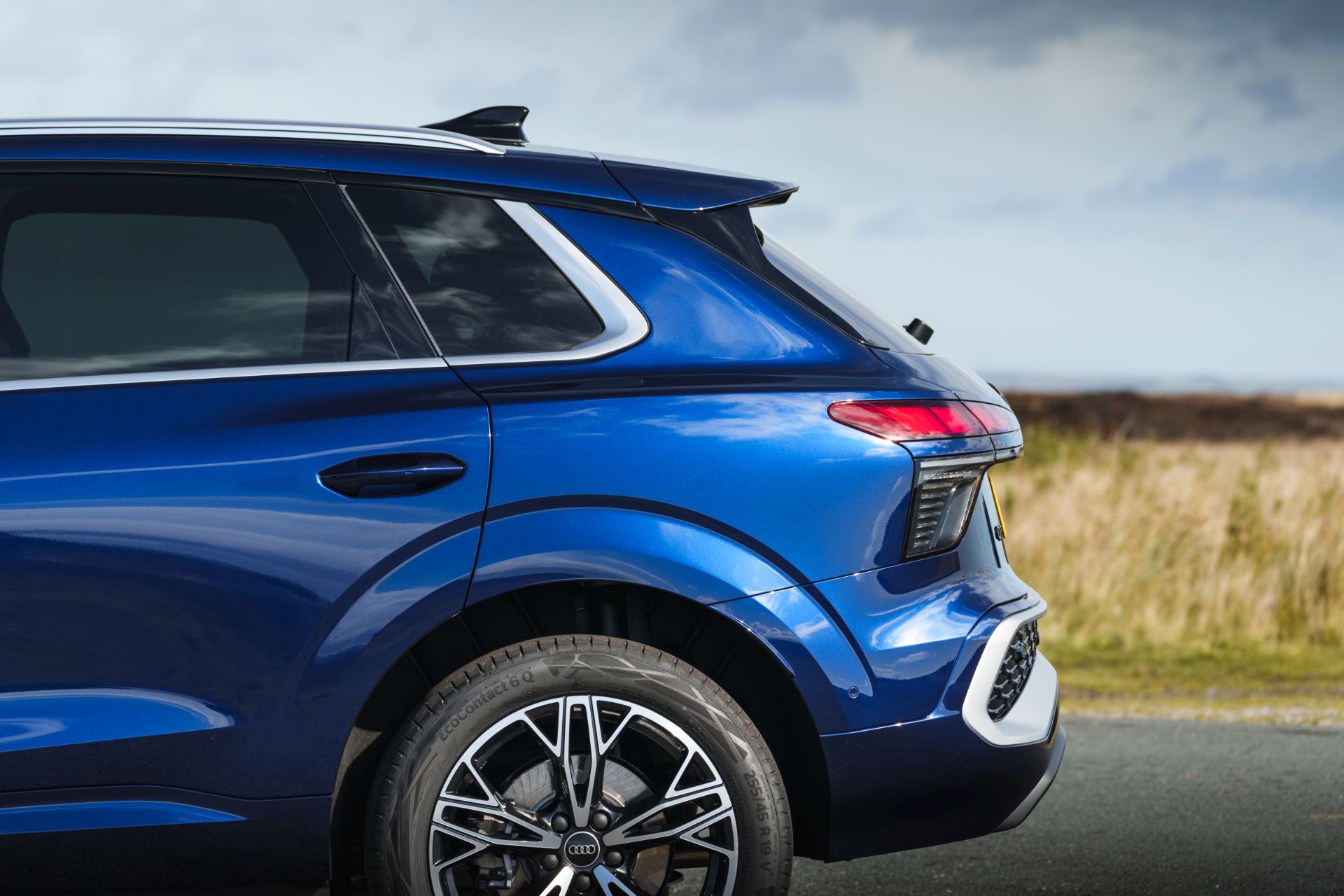 2026 audi q3 e hybrid rear quarter detail blue