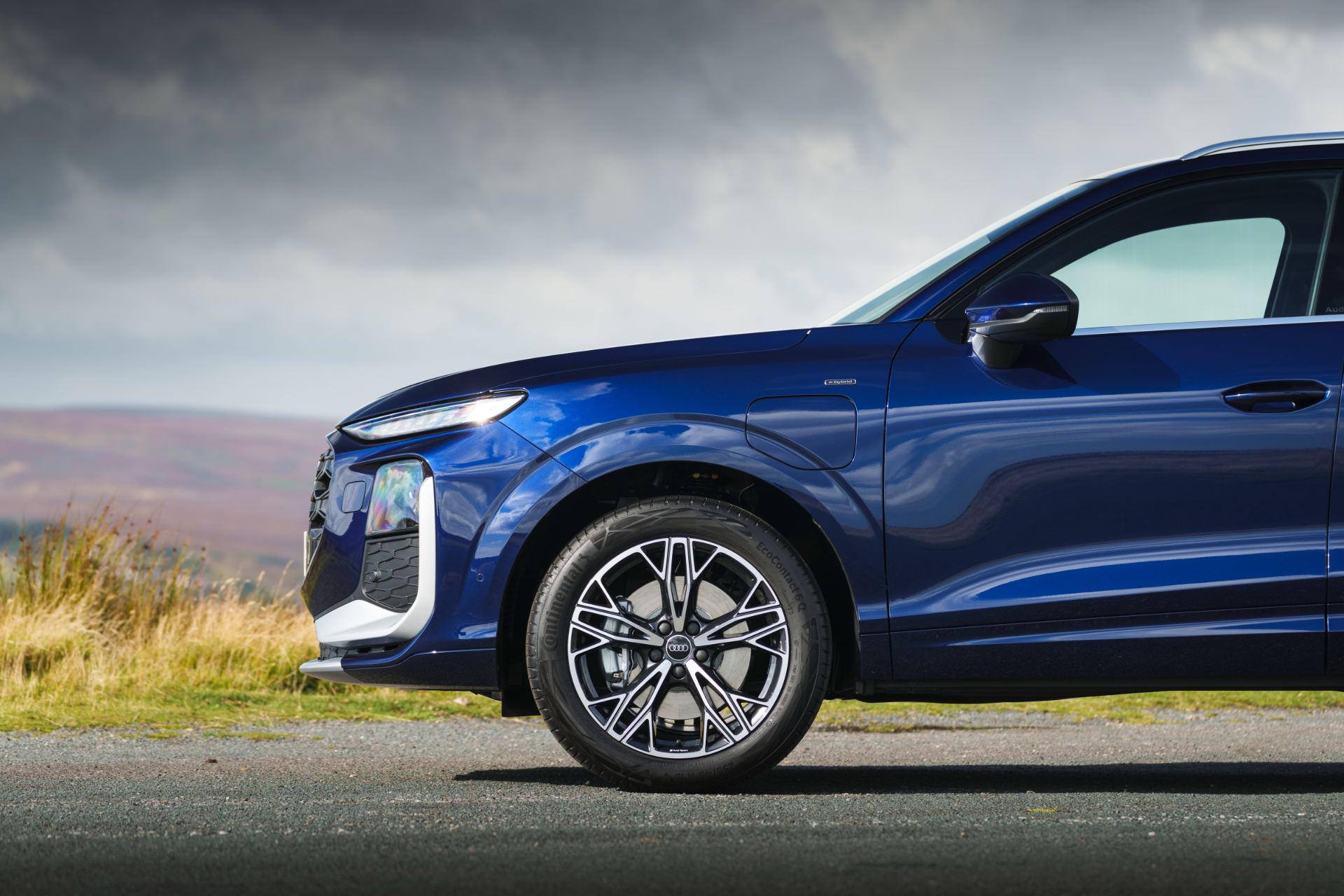 2026 audi q3 e hybrid front quarter wheel blue