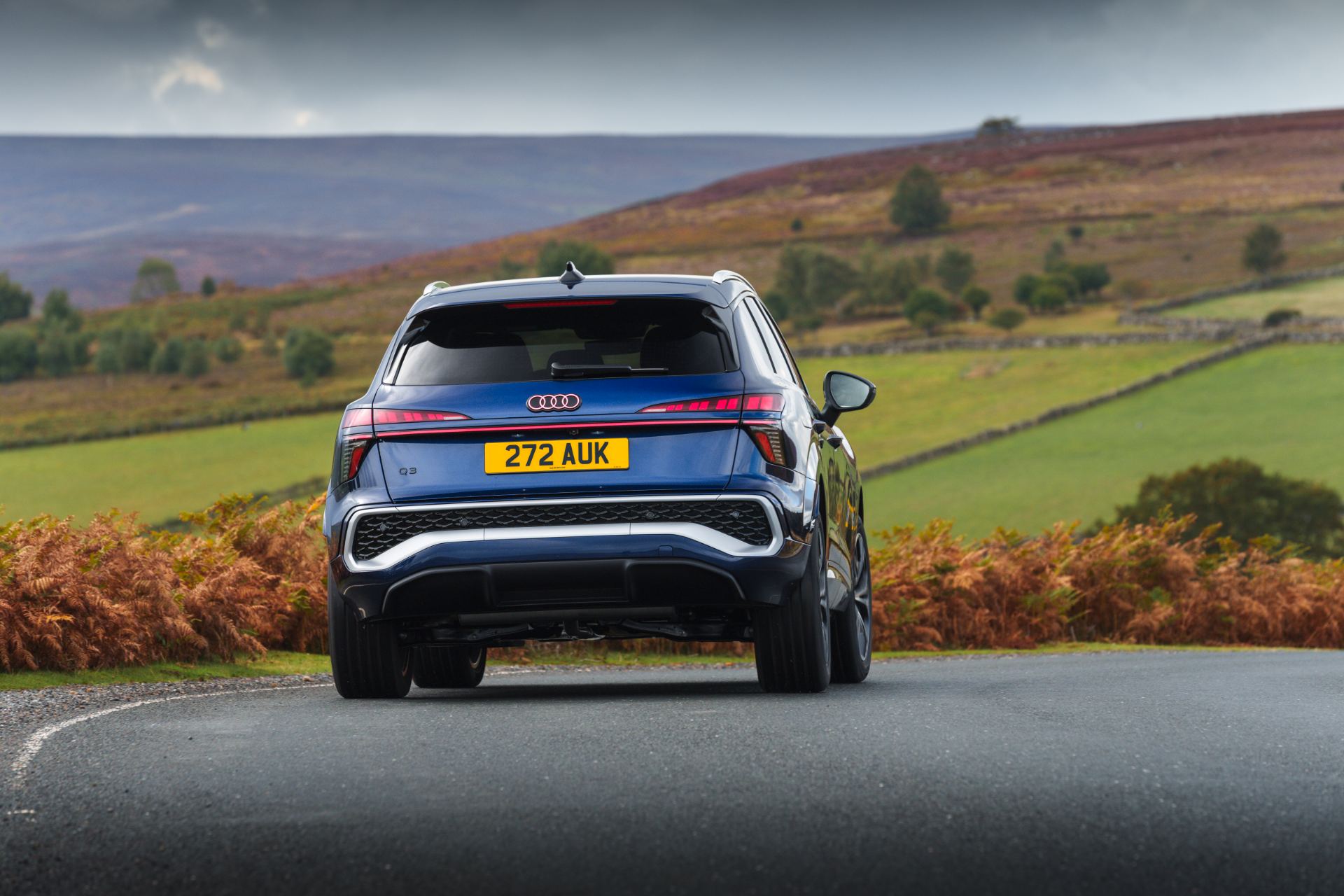 2026 audi q3 e hybrid rear country road blue