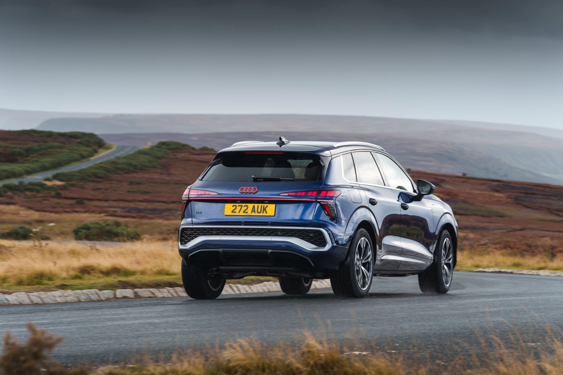 2026 audi q3 e hybrid rear three quarter bend blue