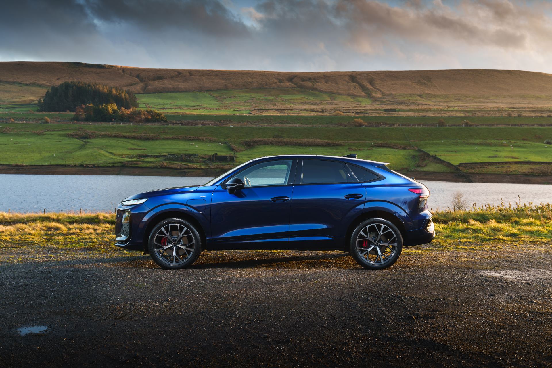 2026 audi q3 sportback e hybrid side profile reservoir blue