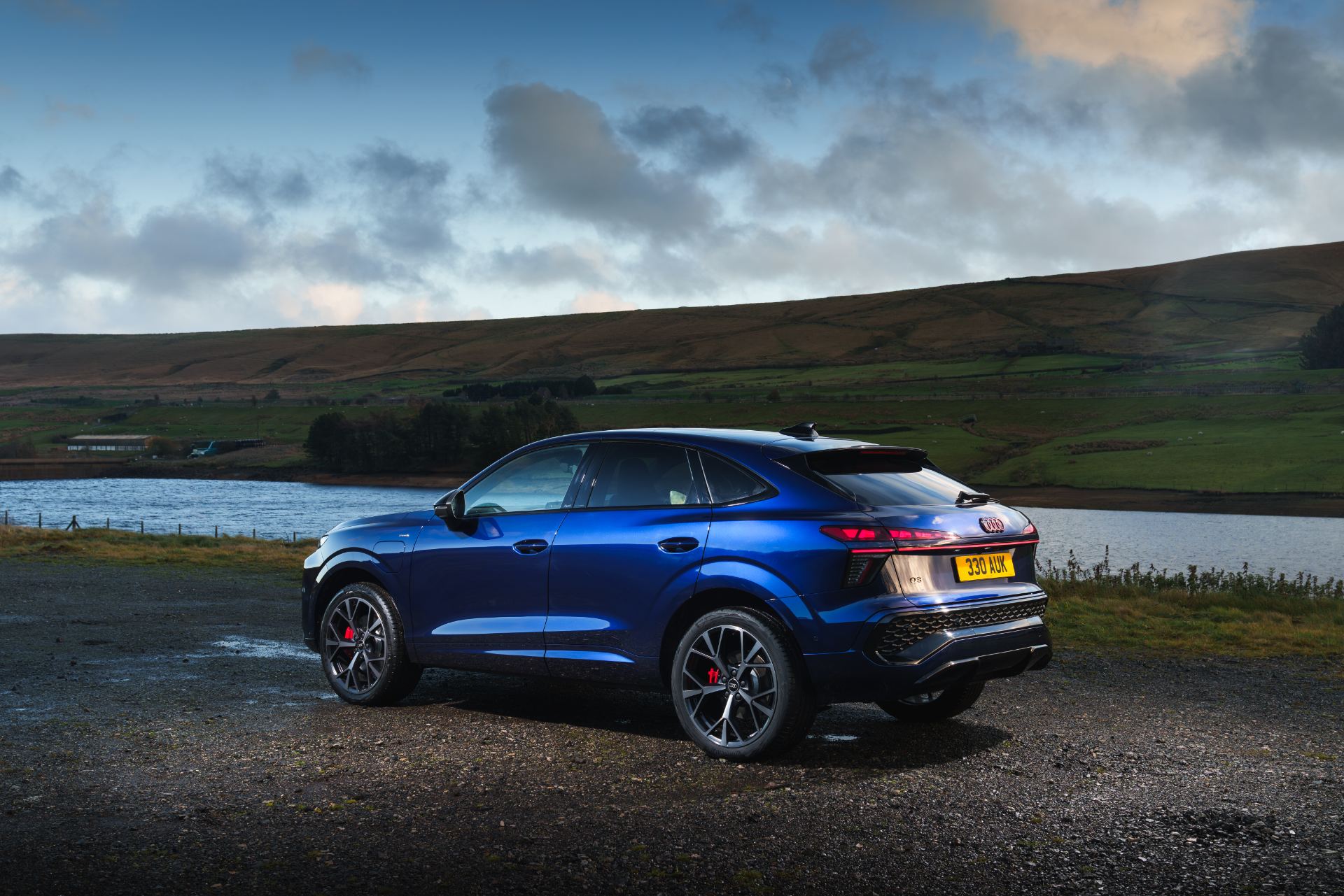 2026 audi q3 sportback e hybrid rear three quarter reservoir blue